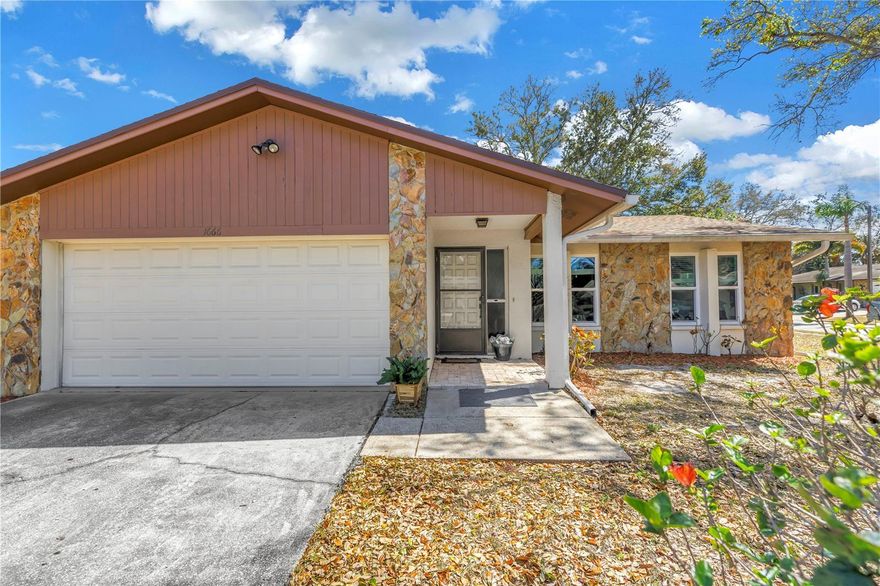 Welcome to Monterey Gardens, a beautiful and quiet established community in the heart of Clearwater known for its mature trees and charming neighborhood feel. Tucked within this desirable location just minutes from the beach, this well maintained FURNISHED 3 bedroom, 2 bathroom home offers over 1,500 square feet of comfortable living space with thoughtful updates throughout. Arriving at the home, the large corner lot and shade from mature trees create inviting curb appeal, while the two car garage and covered entry add everyday convenience. Inside, the spacious layout features both a living room and a separate family room, offering flexibility for relaxing, entertaining, or creating dedicated spaces for work and play. The family room is anchored by a beautiful stone fireplace and accented by warm wood ceiling beams, creating a cozy and inviting atmosphere. The kitchen is centrally located and features newer stainless steel appliances, ample cabinetry, and generous counter space for everyday cooking. It opens easily to the surrounding living areas, making it ideal for gatherings and daily life. Sliding glass doors lead to the screened-in lanai where you can enjoy Florida’s outdoor lifestyle year round while overlooking the fully vinyl fenced backyard. The owner’s suite offers comfortable space and convenient access to the updated bathroom with dual sinks and a modern vanity. Two additional bedrooms are well sized and share a second bathroom, making this home ideal for families, guests, or a home office setup. Major updates provide peace of mind including PGT Winguard impact windows and slider installed in 2020, a full AC system replacement in 2020, a roof replaced in 2021 with a 15 year transferable warranty, newer appliances, newer fence, new interior doors, and a garage door installed in 2018. The location places you close to everything Clearwater has to offer. Just minutes away are Eagle Lake Park, the Highland Recreation Complex, the Pinellas Trail, shopping, dining, and the world famous Clearwater Beach. This home combines a peaceful neighborhood setting with convenient access to everyday amenities and Florida’s best outdoor destinations.