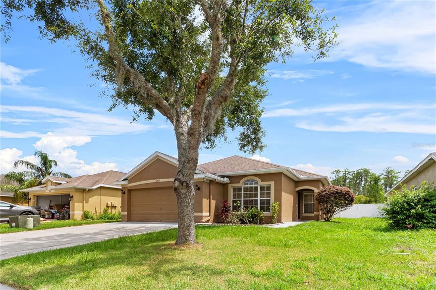 Enjoy stunning pond views from the screened lanai of this well-maintained home, ideally situated on a spacious lot with no rear neighbors. Located in the gated community of The Verandahs, this property features 3 bedrooms, 2 bathrooms, a 2-car garage, and a versatile bonus room that is ideal for a home office, den, or formal living space. The open-concept kitchen overlooks the family room and breakfast area, featuring a snack bar, solid-surface Corian countertops, and rich wood cabinetry. The owner’s suite is privately tucked away from the secondary bedrooms and includes a large bath with dual vanities, Corian counters, a garden tub, and a separate shower. All bedrooms are carpeted, while ceramic tile covers the wet areas and main living spaces. Additional features include a spacious indoor laundry room with a utility sink, a brand-new water heater, and a finished epoxy floor in the garage. The home is equipped with a whole-house water filtration system and chlorinator, plus reverse osmosis in the kitchen for extra purified drinking water. The Verandahs community features a gated entrance, community pool, and playground, with plans underway for a future clubhouse. This home combines peaceful natural surroundings with modern comforts in a secure and welcoming neighborhood.