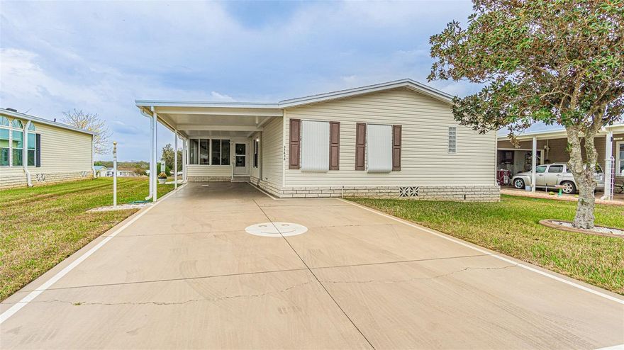 FULLY FURNISHED and UPDATED home in the GATED 55+ community of Grand Horizons, where you OWN the land and enjoy active, resident owned amenities! This beautifully maintained 3-bedroom, 2-bath Jacobsen home offers thoughtful upgrades throughout. From the moment you arrive, you’ll appreciate the painted driveway—complete with a cheerful smiley face greeting—and convenient guest parking. Low maintenance landscape and Hurricane shutters add to the appeal. Once inside, discover a spacious island kitchen featuring generous wood cabinets which can be painted or stained, a large pantry, plus a second cabinet pantry, breakfast bar, eat in dinette, stainless steel sink with soap dispenser, Whirlpool smooth-top range, new disposal, laminate/LVP flooring throughout and vaulted ceilings that enhance the open feel of the kitchen and living areas. A sliding glass door leads to the bright Florida room, creating additional living space perfect for relaxing with a book or enjoying your favorite beverage. The kitchen is OPEN to the dining and living rooms, making entertaining effortless. This is a great floor plan for multi generational family or a caretaker to have their own space! The split-bedroom floor plan provides privacy for you and your guests. The primary suite is generously sized and features an oversized walk-in closet with convenient access from both the bedroom and the en-suite bath, which offers dual sinks and a walk-in shower. On the opposite side of the home, two additional bedrooms and a hall bath comfortably accommodate guests. The interior laundry room doubles as a craft/sewing room or home office, complete with built-in desk, storage cabinets, utility sink, and a window for natural light. An attached shed provides additional storage space. Dont miss the PREMIUM LOT with No rear neighbors and an overflow pond during the summer rainy season! Recent upgrades since 2023 include luxury vinyl plank flooring throughout, new faucets, portable closet organizers, raised commode in the guest bath, new door hardware, freshly painted interior, new light fixtures, added cabinets above the washer and dryer and ROOF with transferable warranty for peace of mind. Residents of Grand Horizons enjoy a resident-owned clubhouse with heated swimming pool, hot tub, shuffleboard, billiards, library, and a full calendar of planned social events, excursions, and activities. Conveniently located near the YMCA, medical facilities, hospitals, restaurants, shopping, movie theater, and bowling. This meticulously updated and decorated home is READY for new owners to MOVE RIGHT IN and enjoy the Sunny Florida Lifestyle! CALL TODAY!