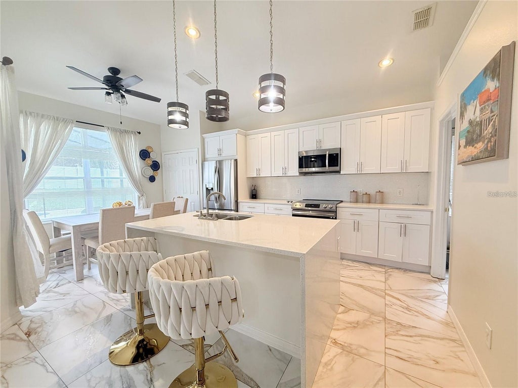 Photo of 2213 Wyndham Palms Way, Kissimmee, FL 34747 (MLS # O6450730)