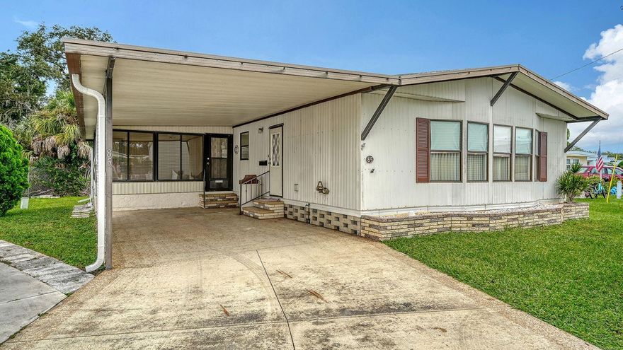 Welcome to this hidden gem in sought-after South Winds MHP that is a 55+ community! This mobile home is turnkey & tucked on a very private lot that backs to a quiet, wooded subdivision in the back and away from the traffic. This home is spacious and comfortable with vaulted ceilings and has 1,212 sq ft under air (1,847 gross sq ft).  Open & Airy Floorplan that offers a Split Plan with 2 Bedroom Suites with large walk-in-closets.  The huge kitchen also has a laundry closet with a washer/dryer and there is a Living Room, Dining Room and French Doors that open into a Florida Room that steps down to a private patio in the back. It is ready for you and affordable living! Conveniently located near amenities and facilities which include a community pool, shuffleboard courts, pickle ball court, bocce court, horseshoe pits, putting green, picnic area, pool room, library and a recreation hall. This park is well managed and maintains the grounds beautifully! Being Sold as-is with the right to inspect. Application to be completed immediately after contract (stop by the office to obtain) & it must be approved by the HOA. The price includes "1 Share" in this co-op. Fees include: Cable TV*Heated Community Pool*Lawn Maintenance*Water & Sewer. This mobile home has been family owned for years and is well maintained:  A/C '17*Roof sealed & secured w/screws '17*Washer '19*Blinds '20 & '23*Water Heater '22*Gutter/Downspouts '24*Thermostat '24 & More. Spacious Carport for Parking & a Storage Shed in the back off of the patio for extra storage.  The location is unbeatable, for it is within a short proximity to one of the top-rated beaches in the country:  Siesta Key Beach! Perfect for a seasonal home or make it your full-time residence. The Gulf Gate shops/restaurants are 3 minutes away, cultural downtown Sarasota 20 minutes away as well as the UTC Mall. You'll love the location of this private lot ... hurry and view it today! This is the one for you!