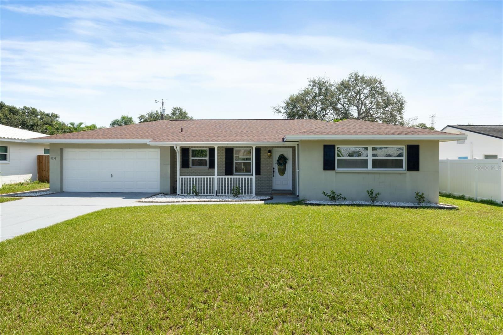 WELCOME HOME to this well-maintained 3-bedroom, 2-bathroom, 2-car garage single-family home located in an established neighborhood with NO HOA and NO CDD. This property offers peace of mind with a brand-new roof (7/2025) and electrical panel (7/2025), a newer A/C (2020), and a water heater (2022). Additional updates include full interior paint, a freshly painted front door and driveway, stained pergola, power-washed fencing, and newer garage door springs. Inside, both toilets have been replaced (2025). This home offers comfortable living with practical updates and a thoughtful layout. Situated just steps from the Pinellas Trail, with a large fenced in yard, it's perfect for outdoor enthusiasts. The location is ideal—only 20 minutes to Clearwater Beach and Tampa International Airport, and just 30 minutes to downtown St. Petersburg. Don’t miss this opportunity to own a move-in-ready home with no additional fees in a prime Pinellas County location.