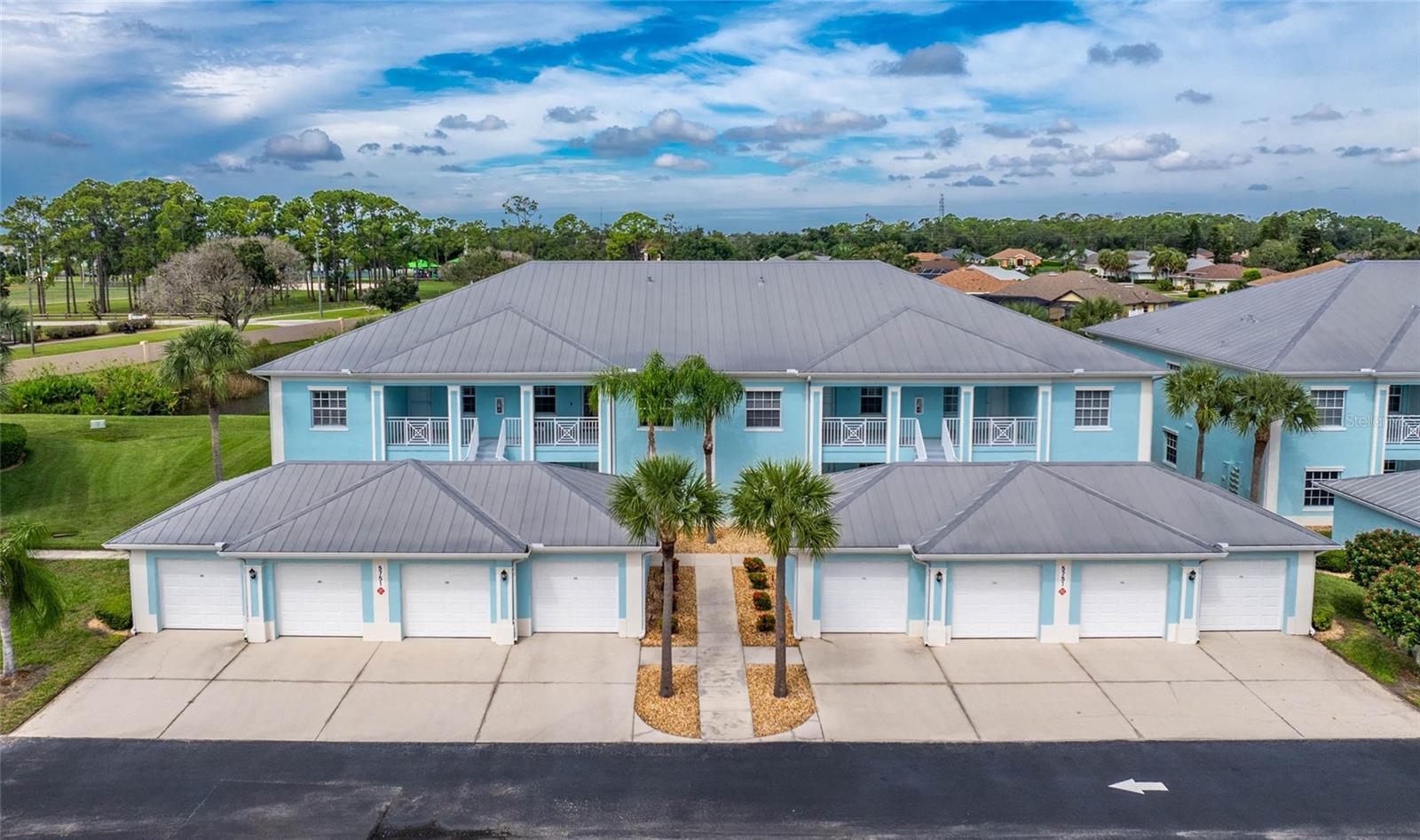 Turnkey Furnished Condo with Gorgeous Lake Views in The Colony at Sabal Trace. This beautifully updated first-floor end-unit condo offers 2 bedrooms, 2 bathrooms, a den, and comes turnkey furnished so you can move right in and start enjoying the Florida lifestyle. From the moment you arrive at the gated community of The Colony at Sabal Trace, you’ll appreciate the lush tropical landscaping and the convenience of pulling into your private one-car garage with an extra parking space outside of the garage as well as overflow parking for guests. Step inside and you’re welcomed by a light-filled interior with modern finishes throughout. Highlights include tray ceilings with crown molding, porcelain tile floors, designer lighting and ceiling fans, granite countertops, stainless steel appliances, and even a wine refrigerator. The spacious kitchen offers 42-inch cabinets, a large pantry, bar seating, and a dining area. The open living and dining spaces are designed around the stunning lake views, creating a serene backdrop for everyday living. Large sliders lead to the screened lanai the perfect spot for morning coffee, evening sunsets, or simply relaxing while watching the wildlife. The primary suite also enjoys tranquil lake views and features a large walk-in closet plus a second closet. The ensuite bath includes a walk-in shower, private water closet, and pocket doors for added privacy. The guest bedroom has its own walk-in closet and is steps from the second full bath with a tub/shower combination. The den is a versatile bonus space currently set up as a TV room/reading nook, complete with a built-in Murphy bed for use as a third bedroom when needed. A convenient laundry closet with a stackable LG washer and dryer, a newer HVAC system (2021), and a new water heater (2023) add to the move-in-ready appeal. Residents of The Colony at Sabal Trace enjoy resort-style amenities including a heated pool, clubhouse, pin pong, billiards, and fitness room…all with low-maintenance living and low fees. This condo checks every box: updated interiors, beautiful furnishings, peaceful lake views, and a welcoming community. All that’s missing is you! Schedule your private showing today and start living the Florida lifestyle you’ve been dreaming of!