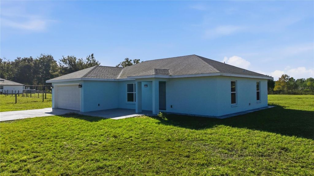 Photo of 10758 SE Highway 464c, Ocklawaha, FL 32179 (MLS # OM715505)