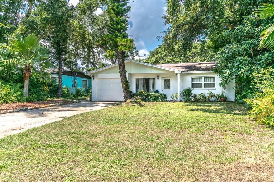 Extra deep, lush, 150' lot waiting for you to create a tropical oasis. Plenty of room for a pool, addition or gardens. Walking distance to the beach access right at the end of your street and the nature path just to the west. This home has a wonderful open floor plan from the kitchen which overlooks a large living area opening up to an inviting screened in patio. As you walk in the front door there is an additional living area great for another TV room, reading room, or large foyer/welcoming space. Additional features include gas to the home and a 1 car garage necessary to store your beach toys! Room measurements are approximated....please verify. ;Water: City