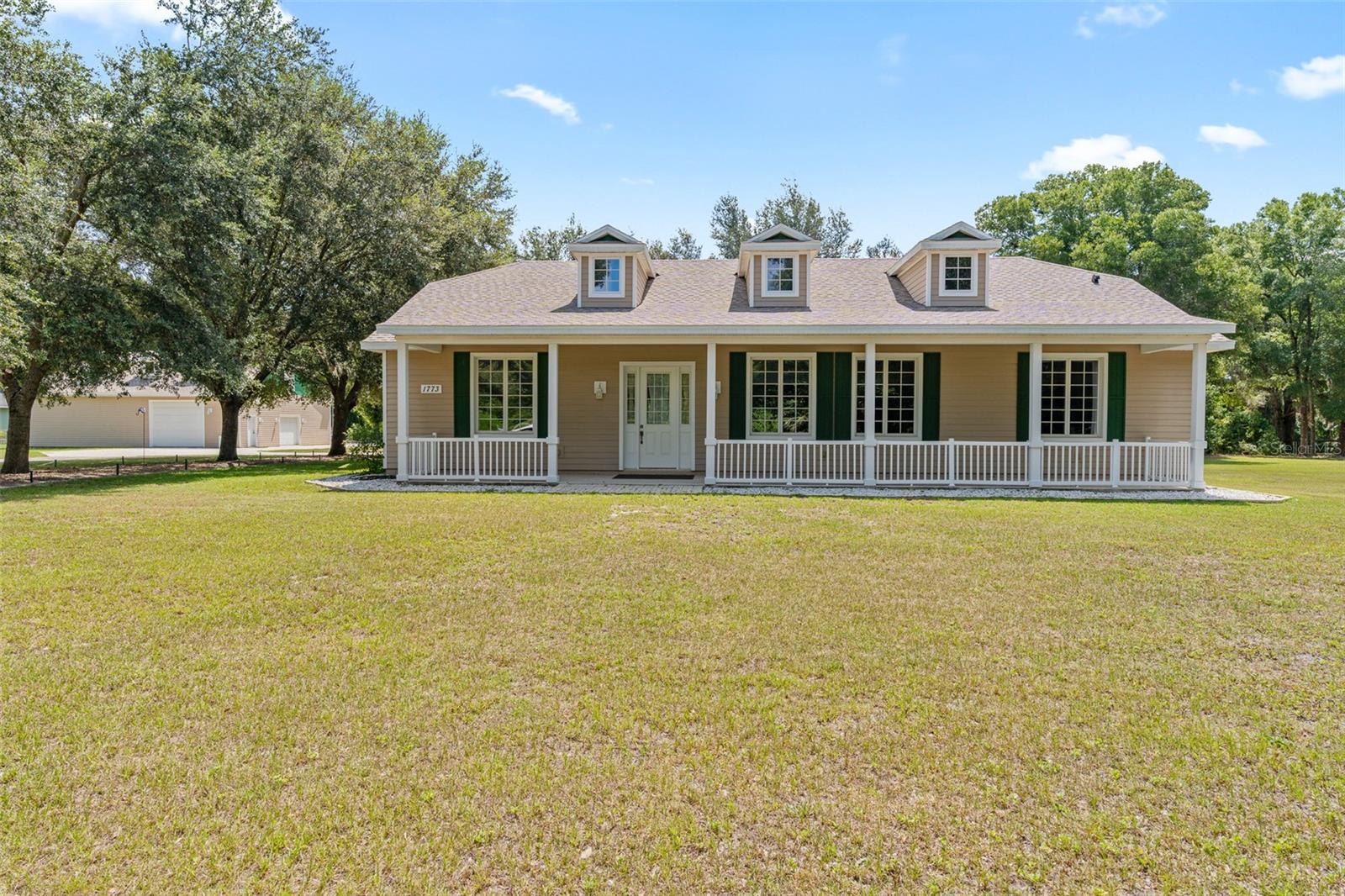 2.5-Acre Florida Country Home with Detached Workshop Garage & Covered Boat/RV Parking in DeLand, Volusia County is waiting for you!
Welcome to your own Florida country retreat! This acreage home for sale in DeLand sits on 2.5 high-and-dry acres in desirable unincorporated Volusia County. Surrounded by mature greenery and the sounds of nature, this property offers the perfect blend of privacy, space, and convenience. If you’ve been searching for a home with land, a detached workshop garage, and covered yacht, boat, or RV parking, this property checks every box.
Inside, the custom-built ranch home features a smart split-bedroom floor plan with private guest suites, oversized walk-in closets, high ceilings, and multiple storage options. The heart of the home is the expansive kitchen with a gas stove, dry bar, and open layout that flows seamlessly into bright and spacious living areas—perfect for family gatherings and entertaining. Additional highlights include a large mudroom/laundry room, enclosed patio, and covered carport. Built with long-term durability in mind, the home offers a concrete slab foundation, insulated block walls, Andersen windows, and a new roof for peace of mind during Florida’s storm season.
Step outside to enjoy endless possibilities on your acreage: space for a garden, mini-farm, outdoor pool and spa, or simply hosting friends and family in the beautiful Florida outdoors. The detached garage workshop is ideal for projects, storage, and multi-car parking, while the oversized covered parking structure provides secure storage for your boat, RV, or recreational vehicles.
This property is perfectly located—offering the tranquility of country living while still being just minutes from downtown DeLand, Orlando, and Florida’s east coast beaches. With room to build an additional guesthouse, this property is not only move-in ready but also offers future growth potential.
Don’t miss your chance to own a DeLand acreage home with workshop and covered RV/boat parking. Tractor negotiable. Schedule your private showing today and start living the Florida lifestyle you’ve been searching for!