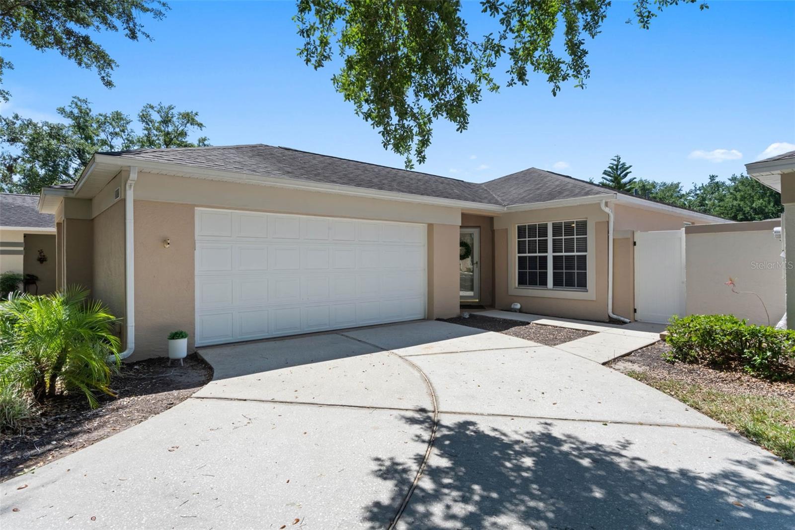 CUTE, COZY, QUAINT AND BEAUTIFULLY MAINTAINED LOCATED IN DESIREABLE KINGS RIDGE A 55+, GATED, GOLF COMMUNITY. The BRISTOL MODEL has two bedrooms, two bathrooms and is 1335 square feet. The home has tile in all rooms, ceiling fans and fresh paint throughout. The kitchen is equipped with all appliances including a new refrigerator, two closet pantries and a breakfast bar. The living room/dining room combo has two sets of sliding glass doors. The living room sliding glass door open up to a fully enclosed lanai with windows, screens and has access to the fully fenced backyard for all of your furry friends to roam and play. The dining room has sliding glass doors that open to a side patio that is great for entertaining. The Primary Bedroom has new blinds, tile and a ceiling fan. The Primary bathroom has a shower, single vanity and a large closet. Bedroom two has a large closet, tile and a ceiling fan. All appliances stay including washer and dryer. Roof is 2016 and HVAC is 2019. The Whitehall Community has its own pool and tennis courts. The Whitehall Community Monthly fees include painting of your home every seven years, lawn maintenance, trimming of shrubs, irrigation system and irrigation for water, Spectrum for Internet, Cable TV and maintenance of the roads. Kings Ridge offers a Royal Lifestyle that offers a multimillion-dollar clubhouse, three heated pools, spas, tennis courts, pickle ball courts, billiards, shuffleboard, stage shows, card games and lots of clubs to join. You can take your golf cart to the Kings Ridge Plaza for all of your grocery, banking, shopping and dining out. The Community is close to all major highways. MAKE YOUR APPOINTMENT TODAY!!