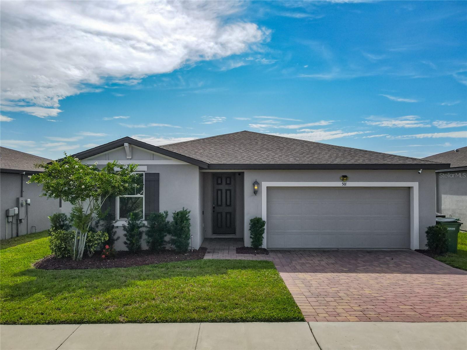 Discover one of the best values in Winter Haven. This modern, move-in-ready home offers exceptional space, thoughtful design, and stylish finishes at an unbeatable price. Located in a quiet community, it features clean curb appeal, a paved driveway, and a fully fenced backyard ready for outdoor living. Inside, the split floor plan offers privacy and comfort, with a spacious primary suite on one side and secondary bedrooms on the other. The open-concept living area brings together a bright family room, a large dining space, and a gorgeous kitchen with granite countertops, stainless steel appliances, shaker cabinets, and a walk-in pantry. The oversized island with bar seating makes it perfect for entertaining or casual meals. The primary bedroom includes a walk-in closet and a private en-suite bathroom with a dual sink granite vanity. Tile flooring flows throughout the main living areas, and the home includes a dedicated laundry room with upgraded front-load washer and dryer. The fenced backyard offers plenty of room to enjoy the Florida sunshine whether you're hosting a barbecue, letting pets roam, or planning future upgrades. This home delivers incredible value and space for the price. Schedule your private tour today.