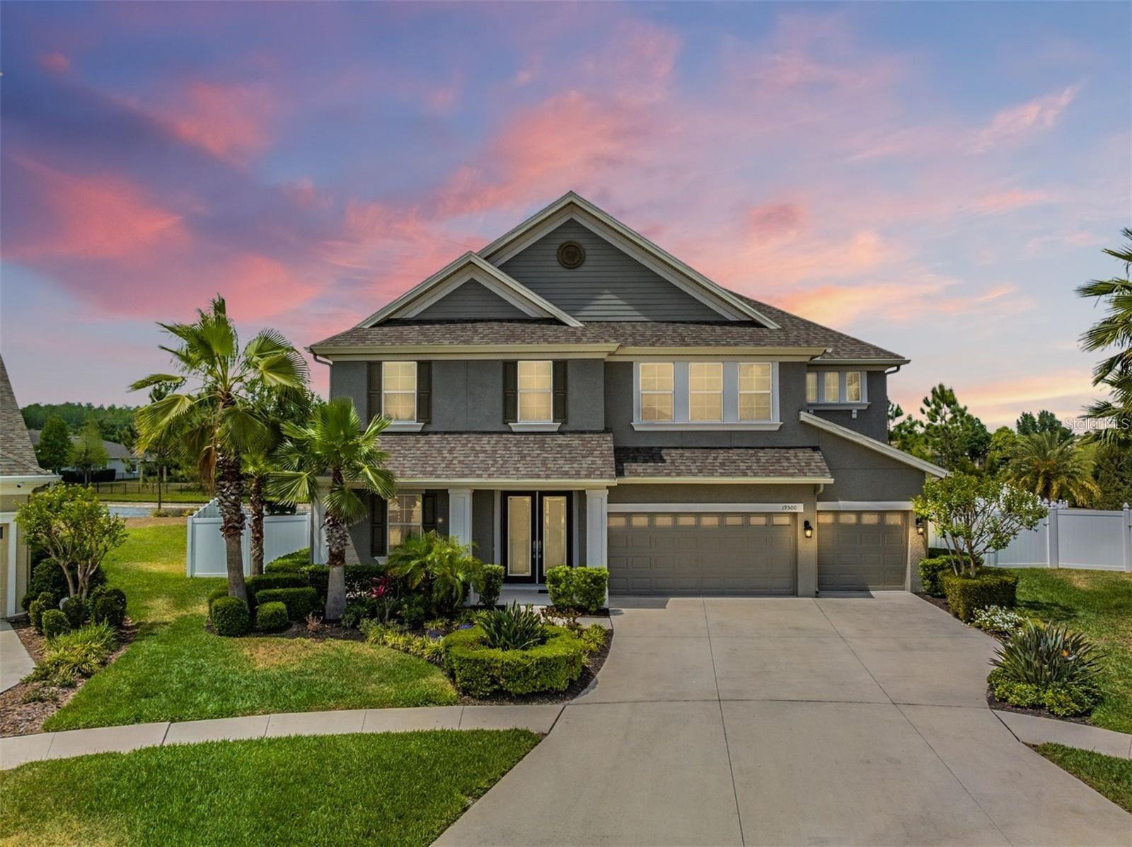 GORGEOUS, SPACIOUS, AND MODERN 7 BEDROOM, 5 BATHROOM, WITH OFFICE, POOL HOME IN HIGHLY SOUGHT LAKESHORE RANCH COMMUNITY! Your search is over! This home HAS IT ALL! Starting inside, this beautiful CHEF'S KITCHEN boasts 42" cabinets, Quartz counter tops, Stainless Steel appliances, Gas Range, Tile backsplash, Huge Island with breakfast bar, Coffee station, and Eat-in Dining space! The Primary Bed/Bathroom is located downstairs and features 2 Walk-in closets with built-in organizers, 2 vanities topped with Quartz, Walk-in shower, and Garden tub! Upstairs there are 6 MORE BEDROOMS, 4 MORE BATHROOMS, AND A HUGE LOFT! Four of the bedrooms share two Jack and Jill style bathrooms! Huge laundry room is located upstairs as well! Make your way out the back slider doors into an outdoor paradise! The screened-in back porch overlooks the MODERN STYLE POOL AND SPA inside the fully fenced backyard with a pond view! This salt water pool/spa is heated and equipped with built-in planters and waterfall feature! The OUTDOOR KITCHEN extends as a bar for extra seating! Elegant pavers surround this entire pool space creating a pure paradise! Other great features of this home include its upgraded staircase, two stone entertainment walls in living room and loft, upgraded light fixtures, and 3-car garage! All of this on a cul-de-sac lot in the highly sought Gated Community of Lakeshore Ranch in Land O Lakes! Lakeshore Ranch Amenities include a Clubhouse, 24-hour fitness center, 3 refreshing pools, business center, billiards, basketball court, tennis/pickleball courts, Dog Park, playground, amphitheater, and community dock! The dock allows fishing and the lake allows canoes, paddle boards, and kayaks! This home is located close to great schools, shopping, and medical facilities! The HOA fee includes internet, cable, and trash! Schedule your private showing today, this one will not last!