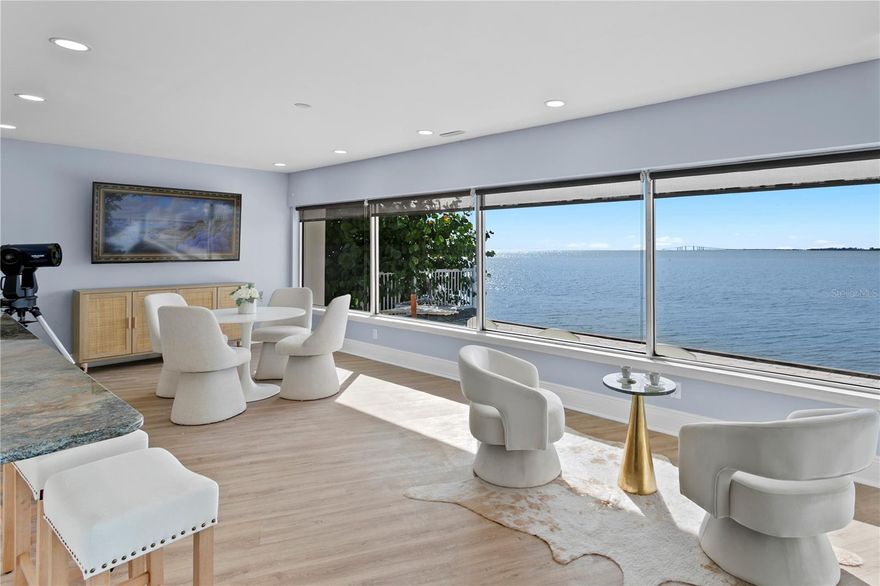 The art of simplicity on deep water with panoramic Skyway Bridge and bay views. Welcome to Dolphin Cove, where every sunset feels painted just for you. This one-story waterfront sanctuary in St. Petersburg blends quiet luxury with effortless livability. This home wasn't built to impress on arrival, it was built to move you once you go inside. Every space feels intentional, every view feels like therapy, offering 180 feet of concrete seawall, two updated docks with lifts (20,000 and 9,000 pounds), and deep-water access minutes to the Gulf. Dolphins glide daily beneath Skyway Bridge views that never grow old. An updated kitchen where you can filet today's catch while watching dolphins play, new floors in main areas, updated secondary baths and a recent roof, this four-bedroom, three-and-a-half-bath home was designed for comfort, connection and coastal elegance. Inside, natural light fills every room while the open plan reveals expansive views that bring the bay indoors. Outside, a dog-friendly runway, large deck, private boat parking, pool and covered patio complement the seawall-lined lot of 0.32 acres, inviting endless waterfront enjoyment. For boaters, anglers and dreamers alike, Dolphin Cove is more than a home, it's a state of mind. Moments from popular beaches, fine dining, boutique shopping, the art scene, St. Pete Pier, The Vinoy Resort, The Don CeSar and The Dali Museum, this address offers a rare combination of privacy, artistry and direct access to Tampa Bay's desired waters. For those who collect moments instead of things and believe peace is the highest form of wealth, this home isn't trying to impress the world, it’s trying to feed your soul. Make it yours. A one of one.