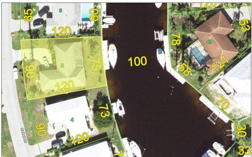 Quick Harbor Access, Sailboat Water, bwide basin view with 40" concrete dock in place.  Damaged house existing on property demo estimate $19,000.