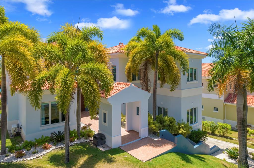 Wake up every morning to breathtaking panoramic views of the Caribbean Sea. This amazing 3-level property, located in Palmas del Mar – one of Puerto Rico’s most sought-after resort communities – has all the charm, space, and on-site amenities you will ever need.
It’s six bedrooms – located strategically throughout the three floors – allow you more than enough room to accommodate you family, friends, and guests. You and your family will enjoy an incredible view from every floor of the home. Relax in a recently refinished private pool and take in the view with your loved ones. The exterior also offers an outdoor kitchen and hot tub. The beautiful property is move-in ready and tastefully decorated with new furniture in almost every room.
The Palmas del Mar community is set in approximately 2,750 acres of land, the resort includes over 25 different neighborhoods, including single family homes, estates, and villas.
Palmas del Mar residential community is an all-inclusive residential and travel destinations that includes a bank, retail shops, the Palmas Academy, an equestrian center, two golf courses, 20 tennis courts, 16 restaurants, a country club with spa, a beach club, security with strict-access control 24 hours a day and a full-service marina and yacht club.