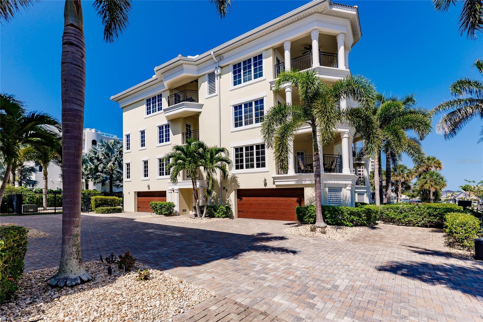 Welcome to “Coastal Oasis”, a luxurious Penthouse rising above the sights and sounds of Siesta Key just a short stroll from what has been named the No. 1 beach in the nation. The residence, located in Siesta Village, is well appointed with 4 Bedrooms and 4 Bathrooms, offers 3,236 sq ft of living space on two levels, with exterior terraces off most rooms and an oversized attached 2 car garage with plenty of room to store all your beach toys; a new elevator quietly takes you to the living spaces with stairs leading up to a large private rooftop deck open to gentle sea breezes, sparkling green gulf waters and amazing sunsets! The main floor boasts an open floorplan, upscale kitchen for the family chef, huge center island for entertaining and a breakfast bar for morning meals while planning your day at the beach or in Siesta Village’s entertainment and shopping district. The second living room is set up as a game room for family entertainment and vacation fun. It is equipped with a full wet bar, sleeper sofa, ping pong and a separate and large exterior terrace. The home’s other delightful terraces encourage al-fresco dining or a serene setting to read and relax as you listen to the rustle of palm fronds or enjoy the setting sun. The inviting primary suite is light and airy and soothes the soul with its en-suite bath including soaking tub, walk-in shower and a lovely terrace where you can enjoy your morning coffee. A second en-suite bedroom serves wonderfully when the home plays host to multiple guests looking for their own peaceful retreat with two additional bedrooms completing the space. This hybrid condo community consists of 12 units; each 4-unit building with its own private heated pool and spa and a gated entrance for security and easy access after a nighttime stroll to the Village for dining and entertainment. Perfectly suited to become your primary residence, a fabulous vacation home or possibly the best of all worlds, combine your personal stays with well-managed rentals for a great investment opportunity! Just bring your swimsuit and flip flops! The residence comes to you turn-key; fully furnished with high-end finishes, furniture and linens – everything you need, down to your beach umbrella and cooler! Matterport walk through video and in-person showings available, don't miss your chance to live the good life in this exceptional Penthouse residence.