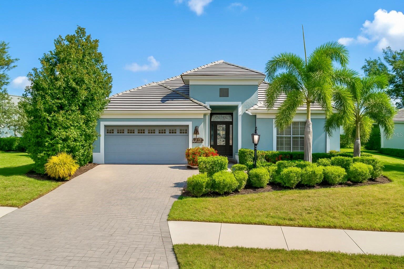 Discover your piece of paradise in this impeccably maintained 3BR/2BA home with a den/office in the gated community of Country Club East. Offering 2,148 sq. ft. of open living, this home features a bright great room, well-appointed kitchen with wood cabinetry, granite counters, walk-in pantry, and breakfast nook. The primary suite includes dual walk-in closets and a luxurious bath with double vanities and walk-in shower. Enjoy Florida living on the covered lanai with a sparkling pool, remote-controlled awning, and tranquil pond views. Additional upgrades include engineered hardwood and tile floors, plantation shutters, tray ceilings, and crown molding.
Country Club East offers resort-style amenities including The Retreat clubhouse, three community pools, fitness center, spa, walking paths, tennis and pickleball courts, dog park, tot lot, on-site dining, and a Lifestyle Director who curates year-round activities—all with maintenance included in a secure, gated setting.
For those seeking more, optional memberships to the Lakewood Ranch Golf & Country Club open the door to four private championship golf courses, three clubhouses (including The Lodge in Country Club East), 20 Har-Tru tennis courts, 20 pickleball courts, two additional heated pools, and a 20,000 sq. ft. fitness center with 70+ classes weekly. Members also enjoy dining, wine events, live entertainment, and an active social calendar.
Conveniently located near A+ schools, shopping, dining, medical facilities, and Gulf Coast beaches, this home blends comfort, style, and an unmatched lifestyle in one of Lakewood Ranch’s premier communities.