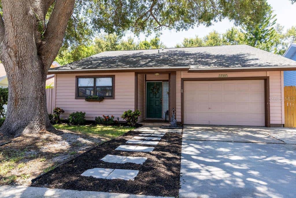Photo of 1707 Whispering Drive E, Largo, FL 33771 (MLS # O6419011)