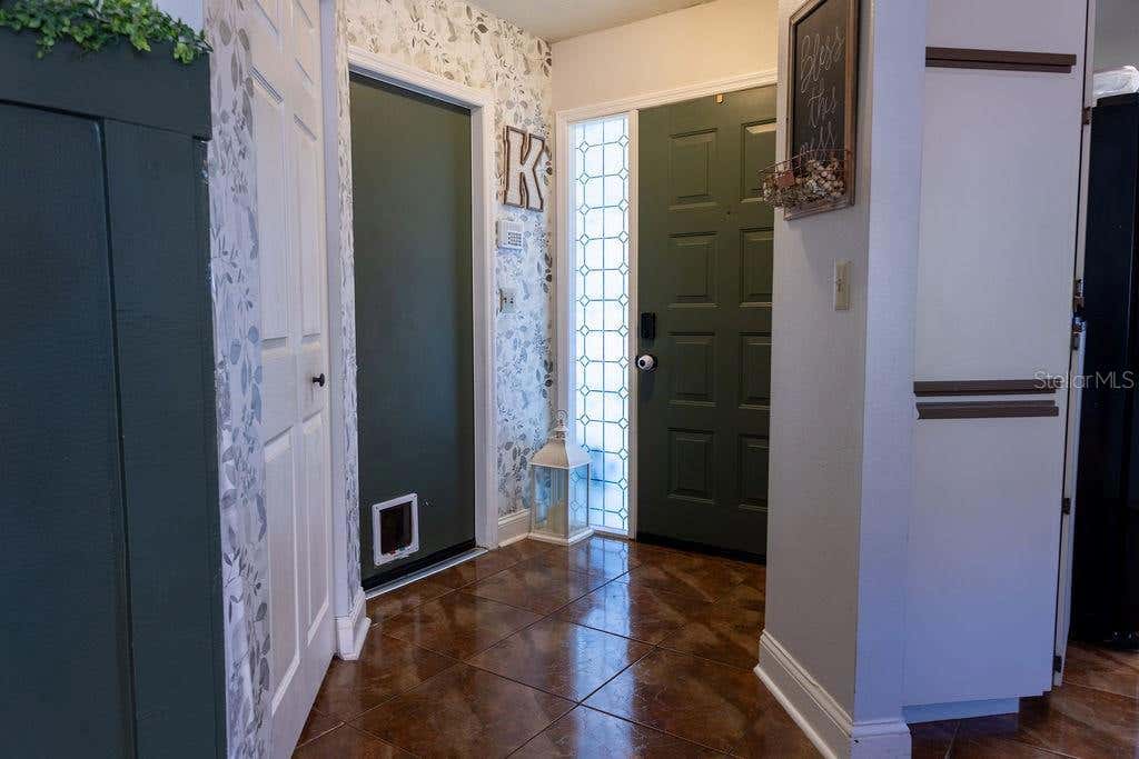 Photo of 1707 Whispering Drive E, Largo, FL 33771 (MLS # O6419011)