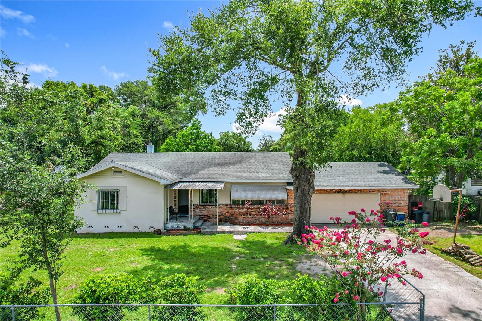 This home is in a well-established neighborhood in Bartow. No HOA. It has a huge, fenced yard with plenty of Parking with nice trees and 2 sheds for storage. It has a 4-car garage. This home does need some TLC. Roof and A/C Unit installed in 2018. Bring your vision and make this home either your Primary Home.