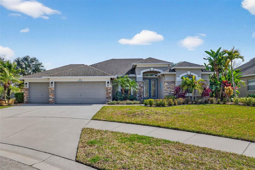 Your private sanctuary awaits in the heart of the highly desirable Harbour Isles community. Situated on an impressive and oversized 0.35 acre cul-de-sac lot, this immaculate four bedroom, three bathroom home offers a rare level of privacy with no rear neighbors and peaceful views of the protected conservation area. From the moment you step through the grand double door entry, you’re welcomed by an expansive open floor plan with soaring tray ceilings and freshly painted interiors that feel bright, clean, and modern. The recently transformed chef’s kitchen is a true showstopper, featuring elegant dolomite granite countertops, a stylish new backsplash, a new sink, and a lowered island designed for improved flow and social seating. The primary suite is a retreat of its own, complete with dual walk-in closets and private French door access to the lanai. The fully remodeled primary bath offers new vanity cabinetry, new countertops and sinks, a custom tile shower, a soaking tub, and new tile flooring, creating a true spa-like experience. Additional bathrooms have been thoughtfully updated, including refreshed cabinetry in the Jack and Jill bath, a fully redone guest bath, and a pool bath that was converted into a private ensuite for added functionality. This home is as smart as it is beautiful, featuring $15,000 in automated remote blinds, a full security system, surround sound speakers, and smart home wiring throughout. Energy efficiency is unmatched with a full solar system that powers the pool and air conditioning, resulting in an incredible average electric bill of just $50 to $70 per month. Step outside to your own tropical retreat enhanced by over $9,000 in professional landscaping. The sparkling saltwater pool and spa are equipped with a newer $6,500 heater, perfect for year-round enjoyment. Additional highlights include impact rated windows, a three car garage with a dedicated workshop addition, an irrigation system, and a brand new soft water system. Located just minutes from the community clubhouse and the waterfront dining spots of Apollo Beach, this home offers the privacy, technology, and efficiency today’s buyers are searching for.