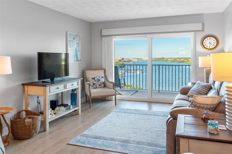 Direct waterfront residence #706 with weekly rentals OK. Invest in long-range water views and sunsets! Relax and enjoy the spectacular water views from your 7-by-25-foot waterfront balcony fronting the living room and main bedroom. Fully remodeled two bedrooms and two baths with over 1,050 square feet. Remodeled open kitchen with granite and solid wood cabinetry, all new appliances, all new windows, all new high-impact balcony sliders, new window treatments, new flooring, newer air conditioner, water heater, new interior doors and new wall finish. Turnkey unit ready for immediate occupancy. This spacious nicely decorated seventh unit is in the heart of Indian Shores. Walk to the nature park, restaurants, shopping and town hall. Beach access right across the street. Boaters dream with docks and slips always available. Short-term rentals OK. Enjoy our large 1,200-square-foot private rooftop sundeck, an ideal spot to watch boat parades. Plenty of waterfront dining and shopping in a short distance. Don't forget about our miles of semi-private sugar sand beaches due to a shortage of street parking. Welcome to Indian Shores Florida. Building amenities such as sparkling waterfront heated pool with spa, tiki hut, barbecue area, fishing dock, rec room with shower facilities plus a clubhouse and gym facilities. Four lighted tennis and pickleball courts plus a putting green make this an active social complex. Deeded beach access right across the street. Enjoy the Florida sunshine. Great family getaway or investment. Buy now or kick yourself later. Virtual tour has photos, tour and floor plans.