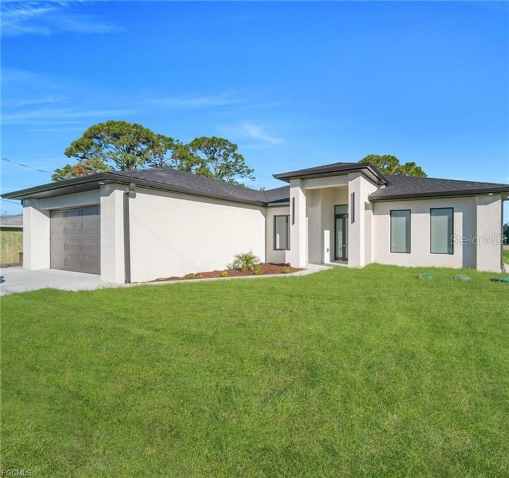 Photo of 4028 26th Street SW, Lehigh Acres, FL 33976 (MLS # A4688702)