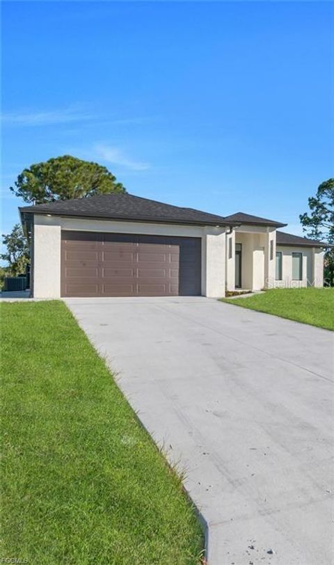 Photo of 4028 26th Street SW, Lehigh Acres, FL 33976 (MLS # A4688702)