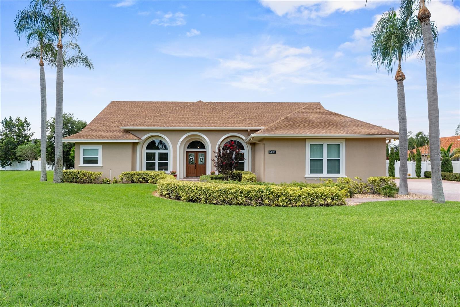 Meticulous Pool Home in South Lakeland’s Highlands-By-The-Lake: Perfectly positioned on a sprawling half-acre inside corner lot in one of South Lakeland’s most desired gated communities, this immaculate 3,685 sq. ft. custom-built residence blends timeless design, countless updates, and a floor plan that is both easy to live in and thoughtfully designed to maximize every inch of usable space. Featuring four bedrooms, three full bathrooms, and a flowing layout, it’s ideal for both everyday living and grand entertaining.
The entry opens to an inviting, architecturally rich interior with elevated ceilings, abundant natural light, and absolutely no carpet throughout. The expansive great room impresses with a double tray ceiling, a wall of glass sliders, and seamless access to the serene pool lanai. The highly functional kitchen was fully remodeled in 2021 and is outfitted with detailed custom cabinetry, granite counters, a breakfast bar, double ovens, a wine chiller, and generous prep and storage space—perfect for holiday feasts or casual gatherings.
The first-floor primary suite has been transformed into a true retreat with a sitting area, pool lanai access, two walk-in closets, and a 2024 remodeled bath featuring handcrafted cabinetry, dual quartz vanities, a soaking tub, and a stunning walk-in shower designed for pure relaxation. Just off the primary sits the office/4th bedroom—an ideal space to work from home, host guests, or use as a nursery. The second bedroom is also located on the ground level, directly across from another newly remodeled guest bath with porcelain tile, a quartz-topped vanity, and a tub with shower.
Upstairs, you’ll find a second living area, the home’s third bedroom, and another guest bath. A walk-in attic with decking provides excellent storage and the opportunity for future expansion. Outdoors, the tranquil pool area offers a covered lanai with TV connection and a sparkling pool with waterfall—the perfect spot to unwind, entertain, and enjoy weekend barbecues.
Recent upgrades include: new double-paned windows and sliders (2023), composite front door (2023), two new AC units (2022 & 2023), new roof (2018), remodeled primary bath (2024), and remodeled downstairs guest bath (2025). Additional highlights include a large laundry room, a side-entry three-car garage with abundant storage, ample parking, a fenced yard for privacy, and so much more.
Highlands-By-The-Lake residents enjoy gated access, a community clubhouse, tennis and pickleball courts and a swimming pool. Living in Lakeland means being surrounded by natural beauty and vibrant culture. With dozens of lakes perfect for fishing and boating, renowned golf courses, scenic parks, and miles of trails, outdoor recreation is endless. Families benefit from excellent schools and libraries, a vibrant downtown, boutique shopping, award-winning dining, craft breweries, and year-round events such as the Sun ’n Fun Fly-In, Mayfaire-by-the-Lake Art Festival, BBQ competitons, Downtown Farmers Market and so much more. Travel is also convenient—Lakeland Linder International Airport now offers commercial flights, while both Tampa and Orlando international airports are less than an hour away, putting the world within easy reach. Come discover the perfect pairing, Highlands-By-The-Lake and Lakeland Florida!