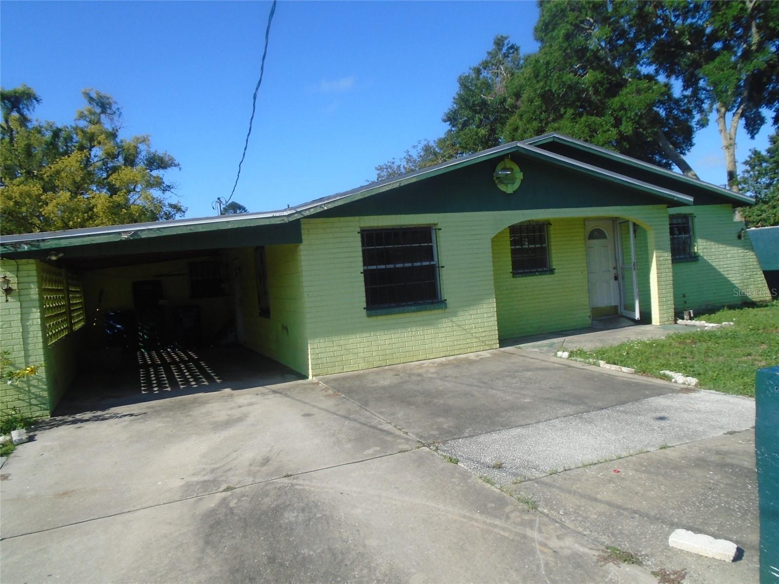 This great block built spanish style home is a handy man special! The home sits on a large lot with a large covered patio. Plenty of room to entertain inside or out. Spacious kitchen and nice size bedrooms. Ceramic tile throughout. Bring your ideas and see this one today! NOTE THE SCREEN PORCH ENCROACHES ON LOT NEXT DOOR. BUYER MUST ASSUME RSPONSIBILITY FOR MITIGATING THIS ISSUE.