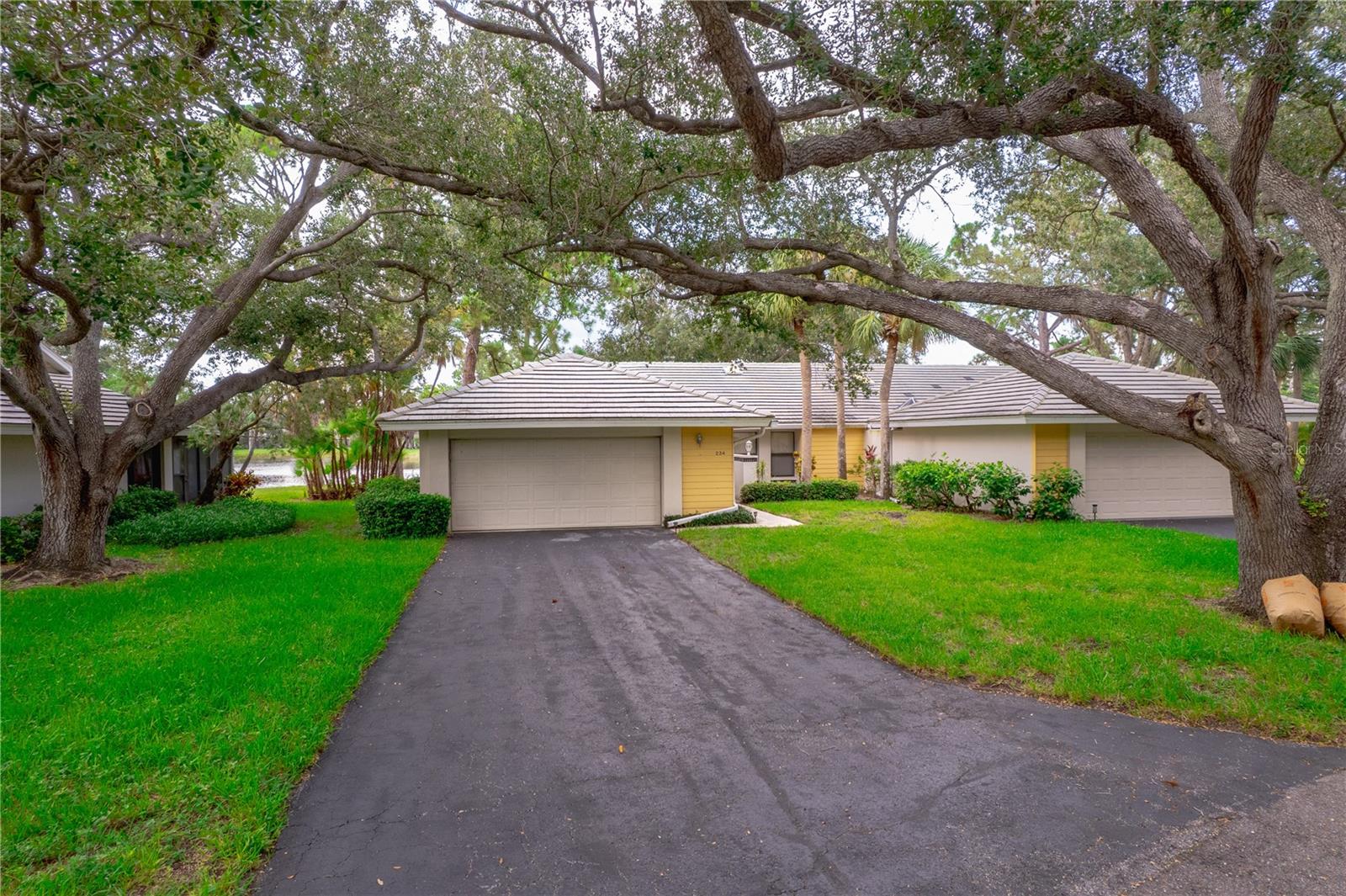 Beautifully updated 3-bedroom, 2-bath villa with stunning lakefront views you can enjoy from your living room in the highly desirable Myrtle Trace community of Venice’s Plantation Golf & Country Club. Since 2019, this home has seen numerous quality upgrades, including tile flooring in the main living areas, luxury vinyl plank in all bedrooms, full interior paint, a custom closet organizer in the primary suite, and new gutters. The kitchen features stainless steel appliances (2020), the guest bathroom was fully remodeled, and the primary bath includes a new vanity and toilet (2022). Additional updates include a new A/C unit (2021), sun shades on the lanai (2023), and a new water heater and electrical panel (2019). Relax on your screened lanai and enjoy peaceful lake views perfect for morning coffee or evening sunsets. The HOA provides maintenance-free living, covering all common area maintenance and landscaping, roof and exterior repairs (including windows, doors, and garage door), roof cleaning, insurance on the exterior of the unit, and basic cable TV. All this in a vibrant, friendly neighborhood just minutes from Gulf Beaches, golf, and the charm of downtown Venice.