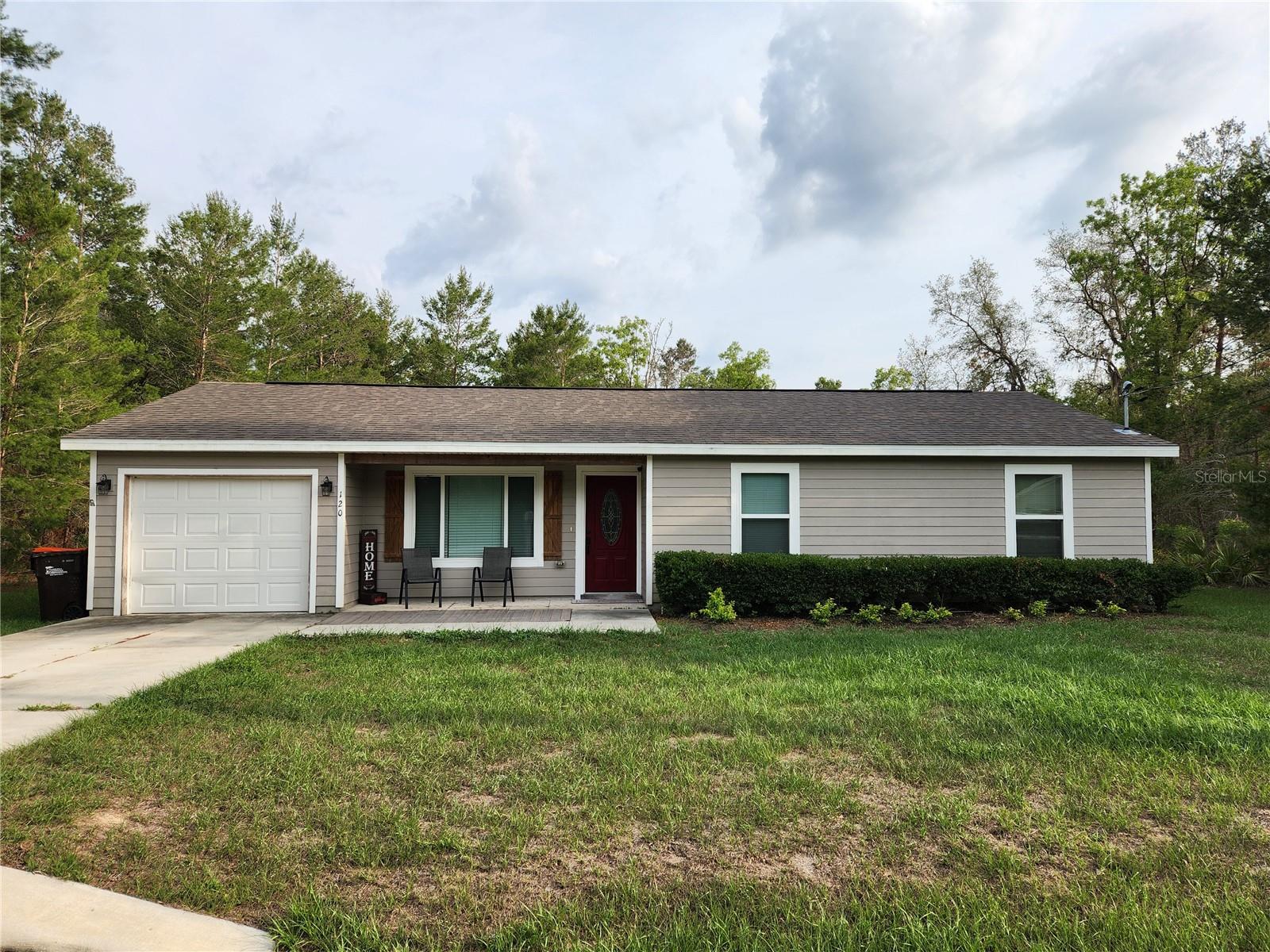 NEW PRICE and a great opportunity! Motivated sellers have relocated out of state and are seeking a quick and efficient sale. This well-maintained single-family home in the East Silver Springs Shores area of Ocklawaha, offers 3 bedrooms, 2 bathrooms in a spacious open concept living area, perfect for entertaining. The kitchen boasts GRANITE countertops and STAINLESS-STEEL appliances. Enjoy the Florida lifestyle on your patio with a spacious yard and fire pit for family gatherings and room for a future pool. There are many upgrades that include waterproof luxury vinyl flooring throughout the house, sliding glass doors to the concrete patio out back, soft close cabinets and drawers in the kitchen and bathrooms, an indoor laundry room with washer and dryer and floor to ceiling deep shelving for all your pantry needs, and a covered front patio to sit out and enjoy your morning brew. This area is close to Lake Weir, accessible to all the activities and shopping in The Villages, no HOA and no CDD Bonds. This home has been loved and cared for and is waiting on its new owners!