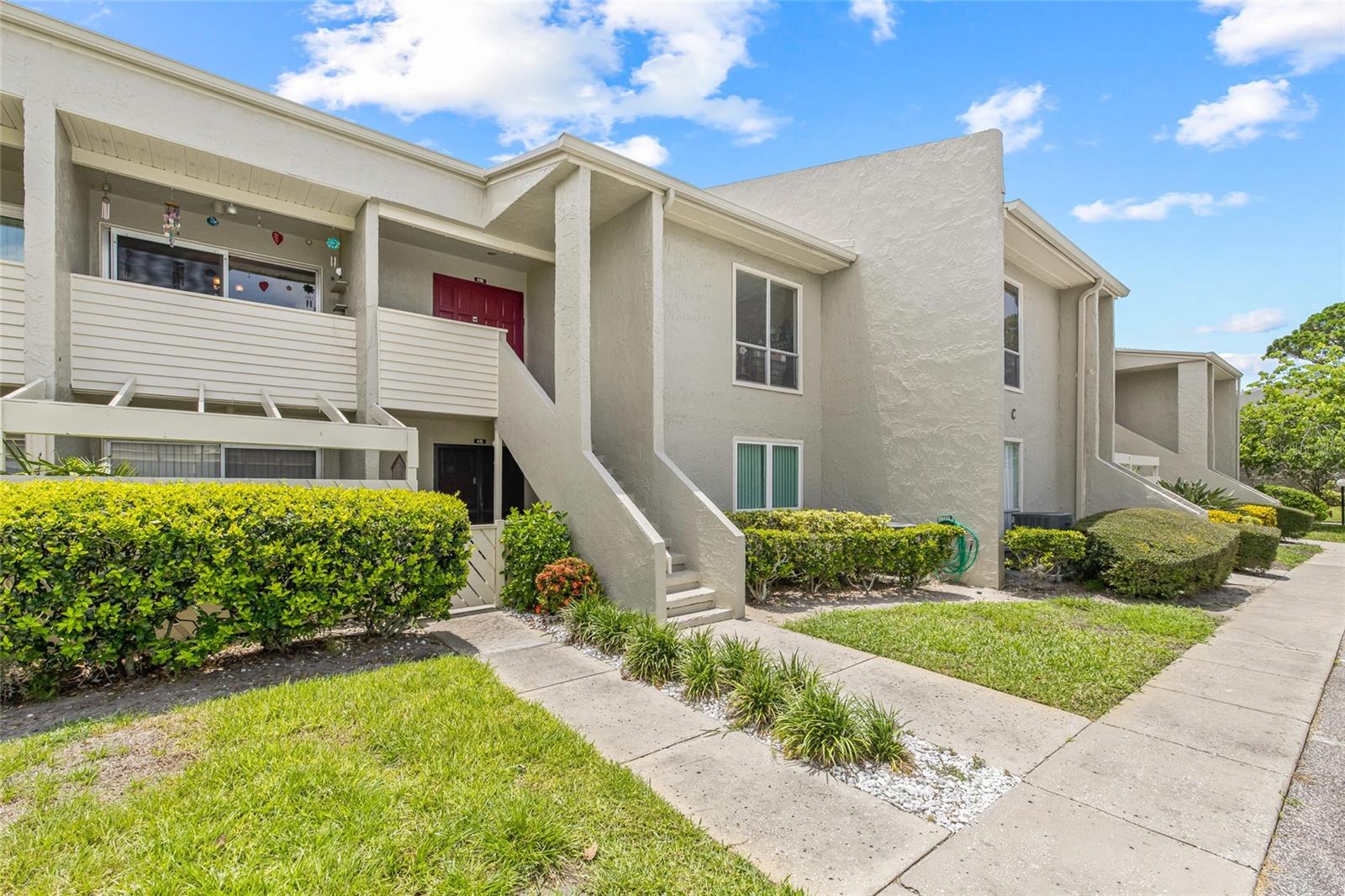 Just 2 minutes to Sunset Beach, 5 minutes to Fred Howard Park, and 10 minutes to the world-famous Tarpon Springs Sponge Docks — this is laid-back coastal living at its finest. Located in the waterfront community of Windrush Bay, this second-floor, 2-bedroom, 2-bath condo is ready for its new owner. It’s been freshly painted, with laminate flooring running through the open living and dining areas, offering plenty of space to relax or entertain. The kitchen has ample cabinet storage and neutral appliances that give you a blank canvas to add your own splash of color and style. The primary bedroom is roomy and includes a unique bonus: the enclosed lanai has been converted into additional living space, perfect for a reading nook, desk, or extra seating. The guest bedroom is on the opposite side for maximum privacy. Both bathrooms have been updated with new vanities and flooring. One even features an upgraded walk-in tub, ideal for seniors or anyone needing easier accessibility. Living in Windrush Bay comes with perks you’ll actually use: a heated pool, fitness center, sauna, clubhouse, fishing spots, and benches along the seawall for watching the Gulf Coast sunsets. And with low-maintenance living (the HOA handles exterior upkeep and lawn care and so much more), you can spend more time at the beach and less time worrying about chores. Speaking of the beach...did we mention you’re less than a mile from Sunset Beach? That’s bike-or-walk-to-the-sand close. And with the Sponge Docks just minutes away, you’ll never run out of restaurants, shopping, and things to do. This is the Tarpon lifestyle you’ve been waiting for. Come check it out!