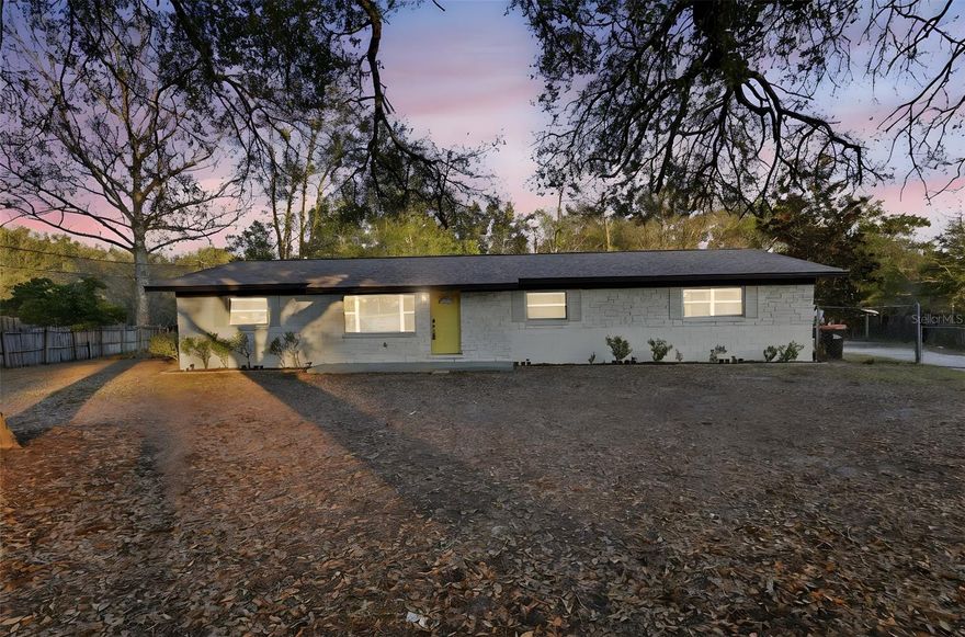 Set on a generous half-acre lot, this beautifully updated four-bedroom, two-bath home offers space, style, and thoughtful improvements throughout. Fresh interior and exterior paint create an inviting first impression, while new flooring flows seamlessly from room to room. The roof was replaced in 2022, and a new A/C will be installed prior to closing providing peace of mind for years to come.
Step inside to a welcoming living and dining area designed for both everyday comfort and effortless entertaining. Just off the entry, the spacious fourth bedroom offers exceptional flexibility with its walk-in closet ideal as a guest room or home office. 
The three-way split bedroom plan ensures privacy for all. Two secondary bedrooms are situated near a beautifully renovated full bath, while the primary suite is tucked away as a quiet escape, complete with a walk-in closet and a thoughtfully updated en suite bath.
At the heart of the home, the inviting eat-in kitchen has been tastefully renovated with new cabinetry and quartz countertops and backsplash creating an inviting and functional space. Just beyond, a large laundry room adds convenience and additional storage.
Outdoors, a covered patio overlooks the fully fenced backyard an expansive setting with room to garden, play, entertain, or simply unwind. A detached two-car garage provides added versatility and storage options.
With its recent updates, great layout, and half-acre lot, this home offers a balance of comfort and function. Schedule your private showing and experience it in person.