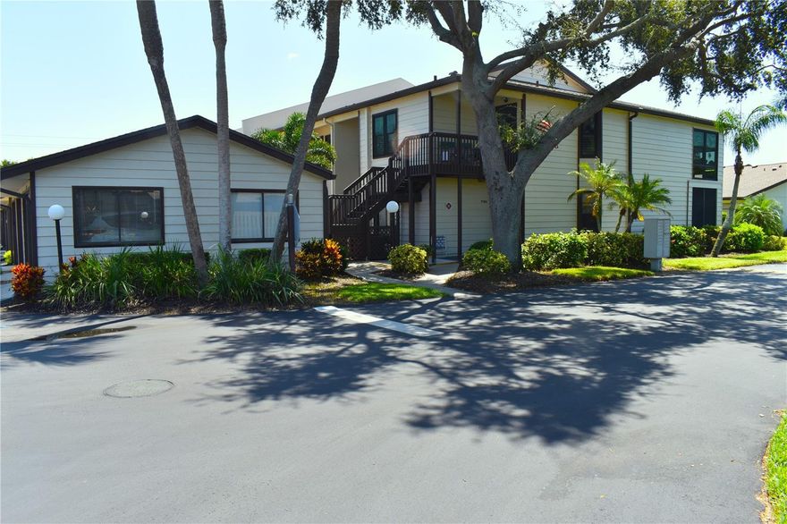 Welcome to this beautifully updated and furnished, END 2nd floor unit condo with a garage in Country Village a 55+ community! Updated doesn't even begin to describe this light and bright SPLIT floor plan unit, 2-bedroom, 2-bathroom (NEWER master bathroom) pulse a large den/office/Florida room with a garage. Making this an opportunity you won't want to miss. This spacious 1,320 sq ft condo has a split floor plan, boasting an array of impressive upgrades that truly set it apart. This condo offers the perfect blend of comfort and functionality. Step inside and you'll be greeted with features of NEW custom kitchen, NEWER laminate flooring throughout, NEWER window treatments (Plantation style shutters), NEW hurricane impact windows, NEW electrical panel, and fans. The soft, inviting paint colors create a soothing ambiance throughout the condo. The master bedroom with walk-in closet and newly updated master bath is just perfect. The NEW kitchen boast quartz countertops, NEW cabinets complemented with farmers sink. The tile flooring in the kitchen flows seamlessly into the breakfast nook area and beautiful NEWER laminate throughout the living areas. Also, within the last couple years all the outside units painted, newer roofs, streets repaved, and new steps installed.                                                                              
         Location is key, across from the Community Center/clubhouse and Pool,  a few miles to Anna Maria Island, shopping, restaurants, churches, and the hospital. This condo will not disappoint.