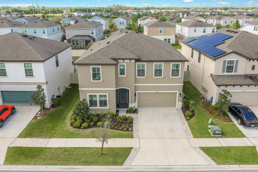 Welcome to the Westbay Pelican floor plan in the highly sought-after Hawkstone community—where spacious design, modern comfort, and everyday functionality come together seamlessly.
Offering 5 bedrooms, 3 full bathrooms, a 2-car garage, a sparkling salt water pool and 3,441 square feet, this beautifully designed two-story home provides the ideal balance of open living and defined spaces. A welcoming foyer sets the tone, leading into a formal dining area that flows effortlessly into the expansive open-concept living room and kitchen.
The kitchen is truly the centerpiece of the home, featuring stainless steel appliances, abundant cabinetry, a custom backsplash, and an oversized island with seating—perfect for entertaining or casual meals. A large walk-in pantry, conveniently tucked near the mudroom, adds both storage and practicality. Just off the dinette, a flexible bonus space offers endless possibilities for a home office, study area, playroom, or creative retreat.
Quadruple sliding glass doors open to a screened lanai and private pool, creating a seamless indoor-outdoor connection ideal for relaxing or hosting gatherings.
Throughout the home, you’ll appreciate the absence of carpet, offering both style and easy maintenance. The first floor features ceramic wood-look tile, while the second floor is finished with durable luxury vinyl flooring.
The main level also includes a guest bedroom and full bathroom, providing a comfortable option for visitors or multi-generational living.
Upstairs, the spacious owner’s suite offers a relaxing retreat with a spa-like en-suite bath complete with dual sinks, a soaking tub, glass-enclosed shower, and a generously sized walk-in closet. Three additional bedrooms share a full bathroom with dual sinks, while a large laundry room and expansive loft provide additional living space perfect for a media room, game room, or secondary lounge.
For added peace of mind, a solar water softener and a whole-house generator conveys with the sale, enhancing both convenience and reliability.
Residents of Hawkstone enjoy access to community amenities including a pool, along with convenient proximity to top-rated schools, shopping, dining, and major roadways.
This home offers the space, flexibility, and features today’s buyers are looking for—all set within a vibrant and convenient community.