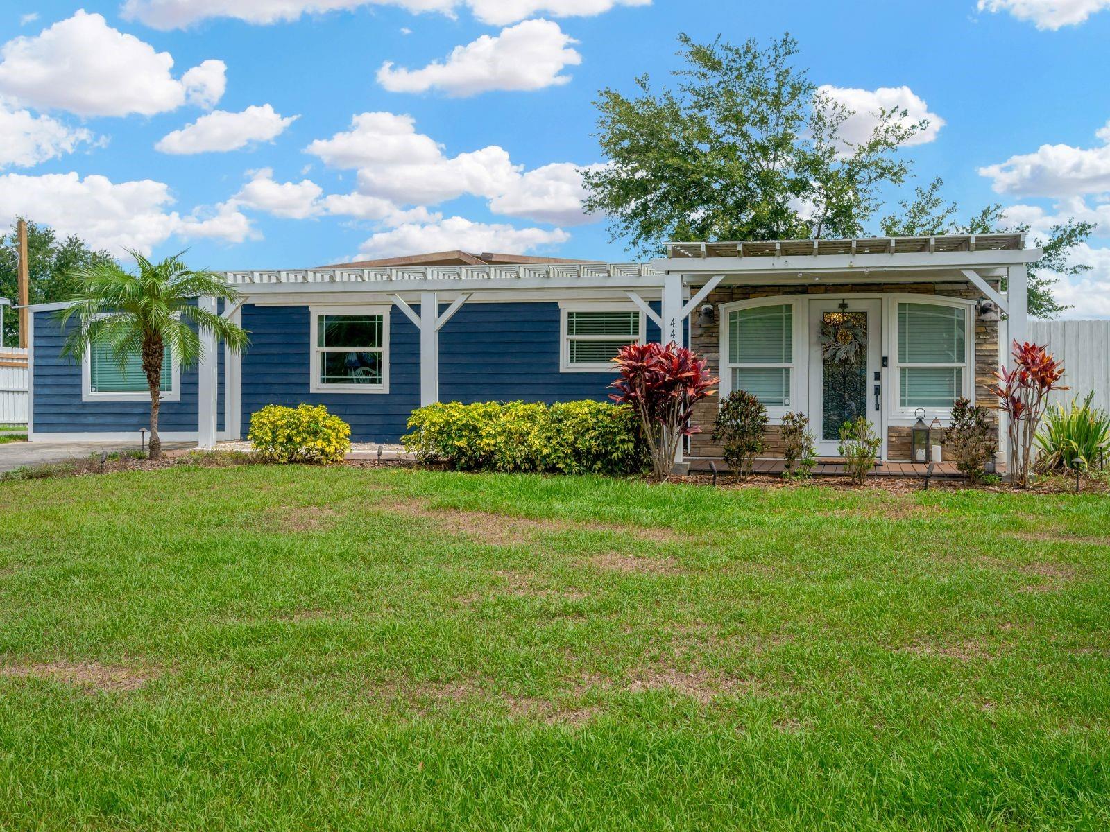 Tucked away on a quiet, dead-end drive off Durant Road lies a hidden gem — a peaceful enclave of meticulously maintained manufactured homes, each nestled on spacious, manicured lots. This particular home radiates French Country charm and must be seen to be fully appreciated.
Florida-friendly landscaping and a durable composite deck pathway welcome you to the inviting front porch and leaded glass entry door. Step inside to a warm and welcoming 12' x 23' family room, featuring NuCore cork-backed waterproof flooring, a stylish light fixture, shiplap accent wall, and a convenient exterior door that opens to a serene side garden.
The kitchen is a true highlight — generously sized and thoughtfully designed with GE Profile stainless steel appliances, durable pine countertops, solid wood white cabinetry and a stunning cast iron porcelain farmhouse sink. Two custom-built pantries and a central broom closet offer exceptional storage, while a granite breakfast bar provides extra seating and flows seamlessly into the spacious dining and living room. There is a stunning beadboard wood ceiling, crown molding and creamy white painted shiplap walls for added character throughout this home.
The private primary suite is a retreat unto itself, complete with an impressive 12' x 14' walk-in closet, an en-suite bathroom, and private exterior access to the private backyard. The bathroom features a jacuzzi tub with hand shower, a generous vanity with ample storage, and a closet concealing a full-sized washer and dryer.
A secondary bedroom (15' x 11') offers its own private exterior entrance — ideal for an adult child, roommate or even a home office. A flexible bonus room with a built-in closet is divided by elegant glass French doors, adding even more versatility to the floor plan.
Exterior upgrades include durable Hardie board siding, 8" thick walls, and energy-efficient PGT EnergyVue vinyl windows with Low-E insulated glass (2019). The ductless mini-split AC/Heating system (2021) ensures year-round comfort, and the waterproof NuCore® flooring with hypoallergenic cork padding (installed in 2019) adds beauty, quiet, and durability throughout the home. The durable metal roof still has many years of life remaining, contributing to this home's truly low-maintenance appeal. Most of the furniture will be left there. NO FHA Financing allowed!