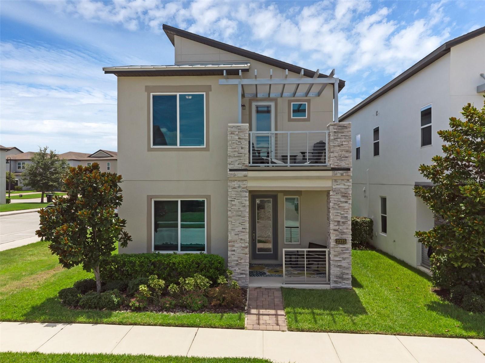 Welcome to your perfect blend of serenity and convenience! This stunning 3-bedroom, 2.5-bath home offers over 2,000 square feet of living space and more than 3,200 square feet total. Situated on a corner lot, built in 2018, with a recently re-painted exterior and paid off solar panels, this home has curb appeal. The beautifully maintained property sits just steps from the West Orange Trail and Park, 10 minutes from historic downtown Winter Garden, 15 minutes from historic downtown Clermont, and less than 2 minutes from the Turnpike and Hwy 50 exit—making it an ideal location for both commuters and adventurers, while maintaining the "get away" feeling.
With a low HOA, enjoy a quiet community complete with a resort-style pool, playground, and dog park. With its modern look, the home itself exudes modern charm and luxury with a welcoming front porch, covered back patio, and a second-floor balcony—perfect for enjoying Florida evenings.
Step inside to find vaulted ceilings, abundant natural light, and an open-concept floor plan designed for both comfort and function. The modern steel and metal stairwell offers a dramatic design element, leading to a versatile layout with two spacious living areas—ideal for a formal dining space, dual lounges, or a media setup. A separate bonus/flex room at the front of the home is perfect for a home office, library, or reading nook. This is a "make it your own" home for any style or occasion!
The kitchen is designed for entertaining, featuring stainless steel appliances, a large island, granite countertops, pendant lighting, and generous storage. The open layout flows seamlessly between the kitchen, living, and dining areas, creating a true heart-of-the-home atmosphere.
Upstairs, all three bedrooms are privately tucked away, including a luxurious primary suite with a tray ceiling, French doors, and an expansive ensuite bathroom featuring dual granite vanities, a walk-in shower, and a large walk-in closet. A second set of French doors adds elegance to the bathroom entrance. Conveniently located on the upper level is a central laundry room for easy access to all bedrooms, and yes, the washer and dryer are included! Also upstairs is a door that leads out to your balcony - Just one more area to relax and soak up the sun.
Beyond aesthetics, this home delivers top-tier functionality and energy efficiency. It includes a rear-entry, detached two-car garage with epoxy-coated floors—perfect for storage or workshop space. It’s equipped with paid-off solar panels, full home surge protection, and spray foam insulation within the concrete block exterior and attic, contributing to year-round energy savings and consistent indoor comfort.
Additional features include a built-in in-wall pest control system, Ring doorbell, smart security system, and overall smart home compatibility, offering peace of mind and modern convenience. Whether you’re working from home, entertaining guests, or simply enjoying a quiet evening on the porch, patio, or balcony, this home was built for effortless living.
Located in a highly desirable area with access to outdoor recreation, top-rated dining, and commuter-friendly roads, this home checks every box for comfort, style, and location. All it needs is YOU. Schedule your private tour today!