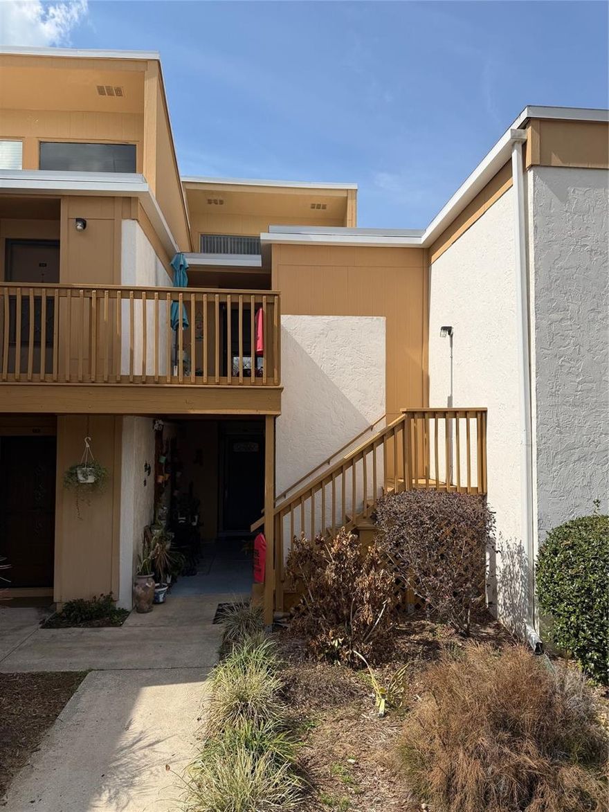 Discover the perfect blend of comfort and lifestyle in this airy second-floor condo, located in beautiful, historic Mount Dora. While many units feel tucked away, this 2-bedroom, 2-bathroom residence is defined by an extraordinary amount of natural light and a refreshing, open atmosphere. The heart of the home features soaring vaulted ceilings and a cozy wood-burning fireplace, but the real showstopper is the wall of patio doors. Open them up to invite in the famous Florida breeze and step out onto your private covered balcony. it is the ultimate spot for a morning coffee or a sunset glass of wine. Or sneak off to the serene community pool. Two bright bedrooms offer ample storage and large windows that continue the home's airy theme. Nearly Maintenance-Free: The HOA handles the exterior, grounds, water, and trash, allowing you to spend your time enjoying the Mount Dora lifestyle rather than doing yard work. Prime Location.  You are perfectly positioned for work and play. Take a stroll to the vibrant downtown historic district to enjoy world-class dining, boutique shopping, and famous art festivals. Golf enthusiasts will love being steps away from the Mount Dora Golf Club, all while surrounded by the town’s iconic canopy oak trees and lakefront charm.