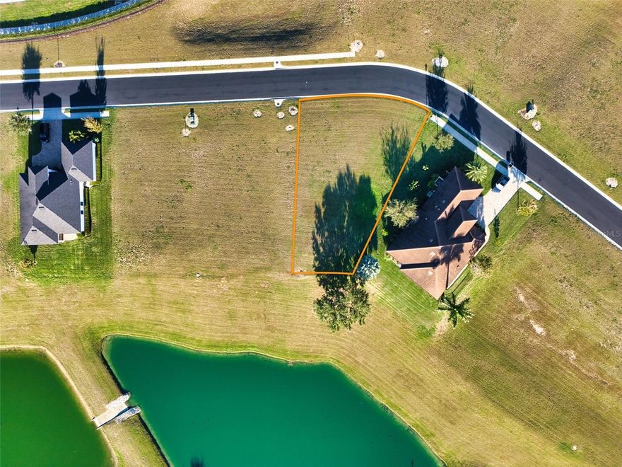 Build your custom home on this 0.27-acre vacant lot located at 816 Waterfern Trail Dr in the gated Water Ridge community of Auburndale. The lot offers a northeast-facing front and a southwest-facing rear, ideal for enjoying sunset views over Lake Van.
Water Ridge features a clubhouse, two pools (including an Olympic-size lap pool), tennis and pickleball courts, fitness center, sauna, private boat ramps with access to Lake Van and Lake Alfred, and boat and trailer storage. Sidewalks and underground utilities enhance the community’s appeal.
Public water, sewer, and electric available. No CDD fees. Conveniently located near I-4 with easy access to Orlando, Tampa, and nearby shopping and dining. Ideal for a custom home or investment opportunity.