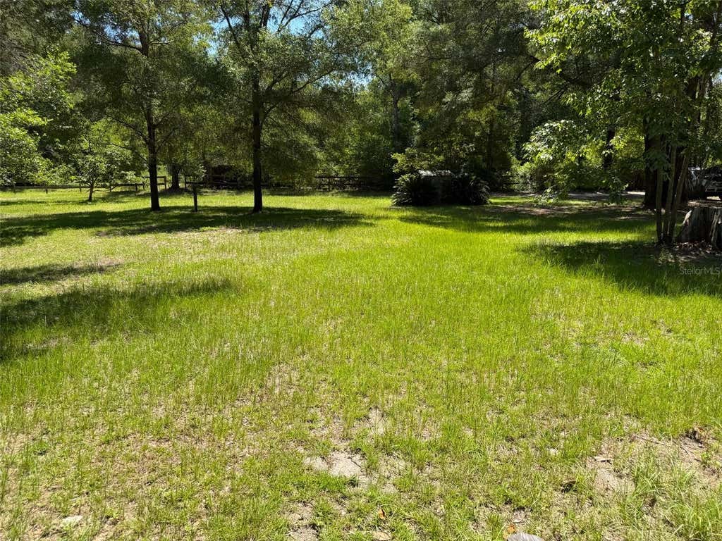 Photo of 18404 NW 272nd Terrace, High Springs, FL 32643 (MLS # GC541454)