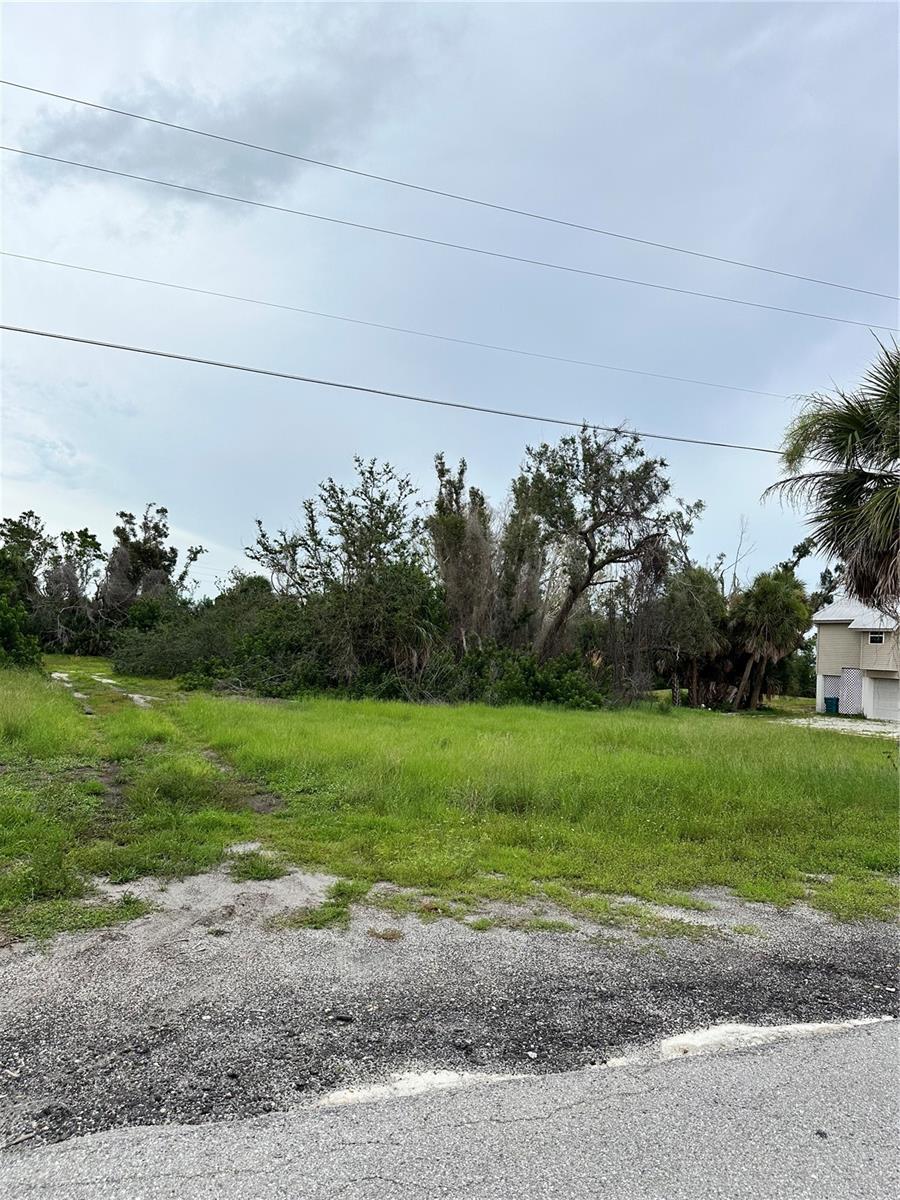 OVERSIZED Lot with .63 of an acre of beautiful land is awaiting a new owner to BUILD your dream home in this admired Cape Haze community. Explore nearby historic Boca Grande, known for its quaint shops, dining, and stunning beaches. Enjoy optional HOA membership featuring social activities and exclusive access to a private beach and dock on Don Pedro Island.