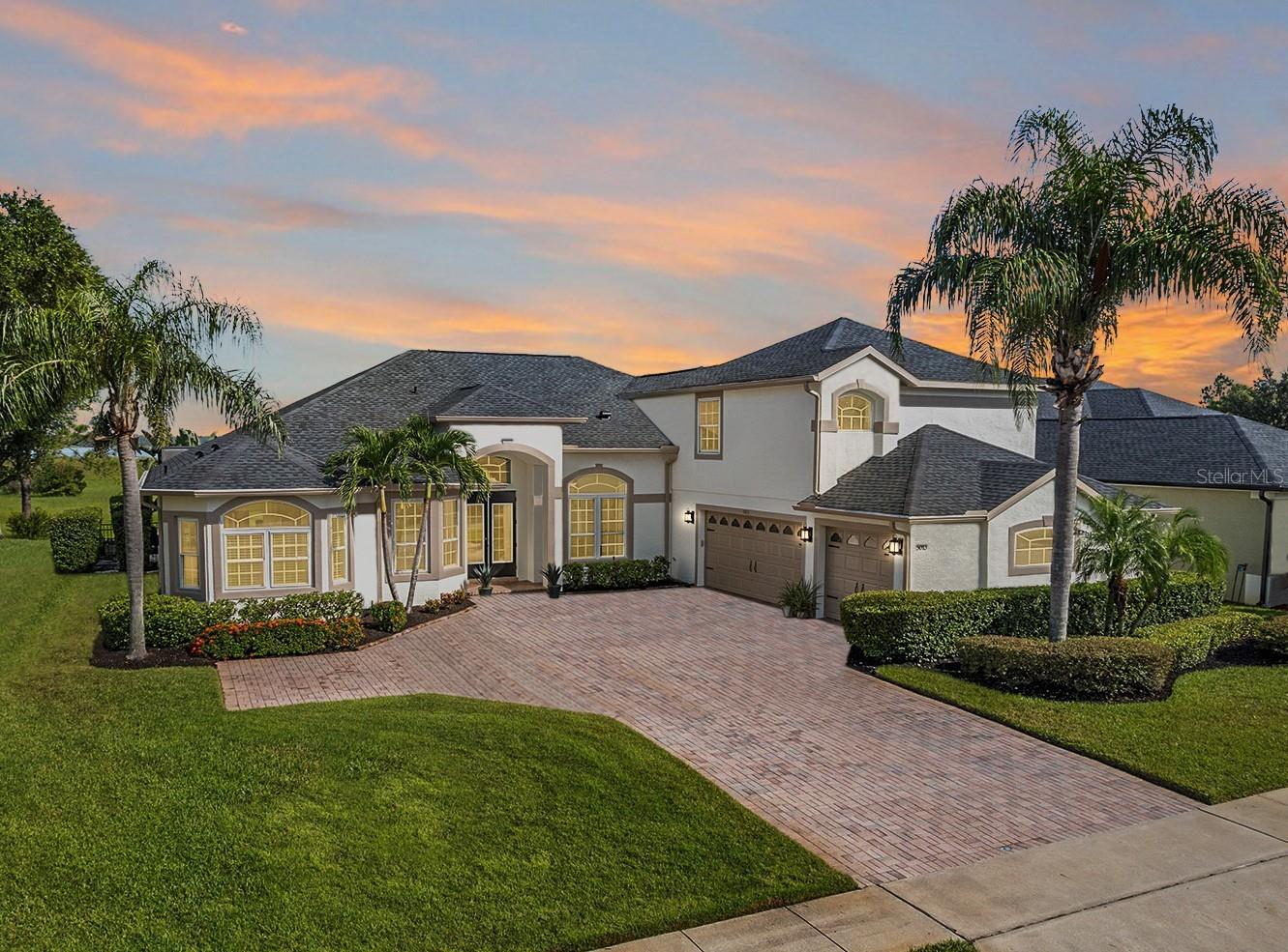 Welcome to 5013 Coveview Drive, an exceptional luxury residence in the coveted gated community of Lake Pointe at Toho. Perfectly positioned on 85 feet of direct waterfront on Fells Cove, this 5-bedroom, 4.5-bath home with a bonus room offers 3,669 sq. ft. of beautifully updated living space on one of the community’s most desirable lots. With no rear or front neighbors and endless conservation and water views, this home delivers both privacy and unforgettable sunsets.
Step inside and you’ll immediately notice the care and investment the owners have made in the past five years—Luxury Vinyl Plank and ceramic flooring throughout, newer interior paint, upgraded lighting, hardware, ceiling fans in every bedroom, and built-in organizers in every closet. The foyer opens to a spacious living room and dining room, with water views drawing you straight through to the heart of the home.
The chef’s kitchen features granite countertops, stainless steel appliances, induction cooktop, custom backsplash, and a pantry closet with custom built-ins. A breakfast nook overlooks the pool and cove, flowing seamlessly into the family room enhanced with surround sound—a perfect setting for both entertaining and everyday living.
The primary suite is a retreat of its own, tucked privately on one side of the home with direct pool access, motorized blinds, dual walk-in closets, and a spa-like bath. On the opposite wing, three additional bedrooms and two baths offer comfort for family or guests. An office/optional bedroom with motorized blinds is also located near the front of the home. Upstairs, a spacious bonus room with a full bath provides incredible flexibility as a media room, game room, or guest suite.
Outdoor living takes center stage with a heated saltwater PebbleTec pool, rock grotto fountain, covered lanai, and screened enclosure—all designed to maximize the water views. The fenced yard and conservation backdrop add peace of mind, while the lot allows for the future construction of a private dock.
Beyond its beauty, this home has been enhanced with numerous upgrades for long-term comfort: roof and water heater replaced in 2021, dual AC units from 2018 and 2019, NEW upgraded slider doors and windows, central vac system, Snaplock garage flooring with retract-a-rack storage, day/night shades, fresh exterior paint and mulch (2025), painted pool deck (2025), and gutter screens.
Lake Pointe at Toho is a gated community that offers residents access to a community pool, covered tot lot and playground, tennis, pickleball and basketball courts, BBQ grills and picnic benches, and scenic walking paths and seasonal community events. This home is located just minutes from Lake Nona, Orlando International Airport, and the highly rated Narcoossee schools. Publix is just 2 miles up the road as well! Nearby attractions include Lakefront Park, where you can take peaceful walks by the water, enjoy playgrounds, or go boating on East Lake Tohopekaliga. Theme parks like Disney and Universal are a quick 40 mins or so away while Cocoa Beach is about an hour drive. With major highways such as 417 and the Florida Turnpike nearby, commuting to Orlando or the theme parks is quick and easy.
This is more than a home—it’s a lifestyle of luxury and waterfront living. Properties of this caliber in Lake Pointe at Toho are rare. Don’t miss your chance to experience it firsthand—schedule your private showing today.