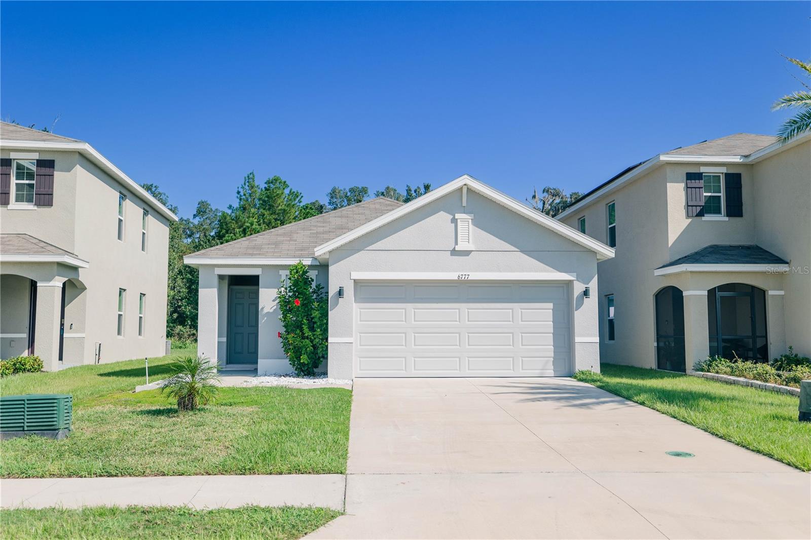 Welcome to Sea Gate Village! This 3BR/2BA home with 2-car garage offers an open floor plan with a separate dining room, ideal for gatherings. Kitchen features dark appliances, pantry, breakfast bar, and dining area. Private master suite includes walk-in closet, dual sinks, and stand-up shower. Secondary bedrooms feature ceiling fans and spacious closets. Laundry room with washer/dryer hookups. Enjoy the pond view from the front porch and a large backyard perfect for outdoor entertaining. Property is tenant occupied until 10/15/2025