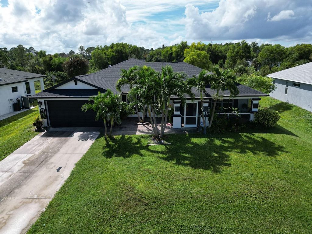 Photo of 3003 25th Street W, Lehigh Acres, FL 33971 (MLS # C7515929)