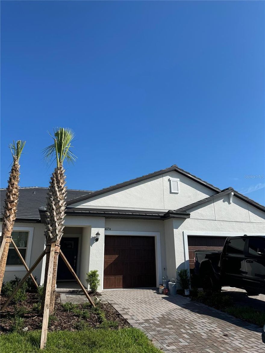 One or more photo(s) has been virtually staged. This comfortable single-story home in an active adult lifestyle community for ages 55 and better, includes 2 bedrooms and an two bathrooms with a well-equipped kitchen, and shared dining and family room. The attached unscreened patio offers outdoor living experiences, while the nearby owner's suite is a private oasis with an en-suite bathroom. Pond view from the master bed, living/patio. You will have everything you need to live a relaxed lifestyle, including resort-style amenities such as the gorgeous 15-acre Lagoon, a swimming pool, clubhouse, fitness center, tennis and pickleball courts. Situated in Pasco County, the community is just a short drive from some of Tampa's most popular dining and retail establishments, such as the Tampa Premium Outlets® in Wesley Chapel and Wiregrass Mall.