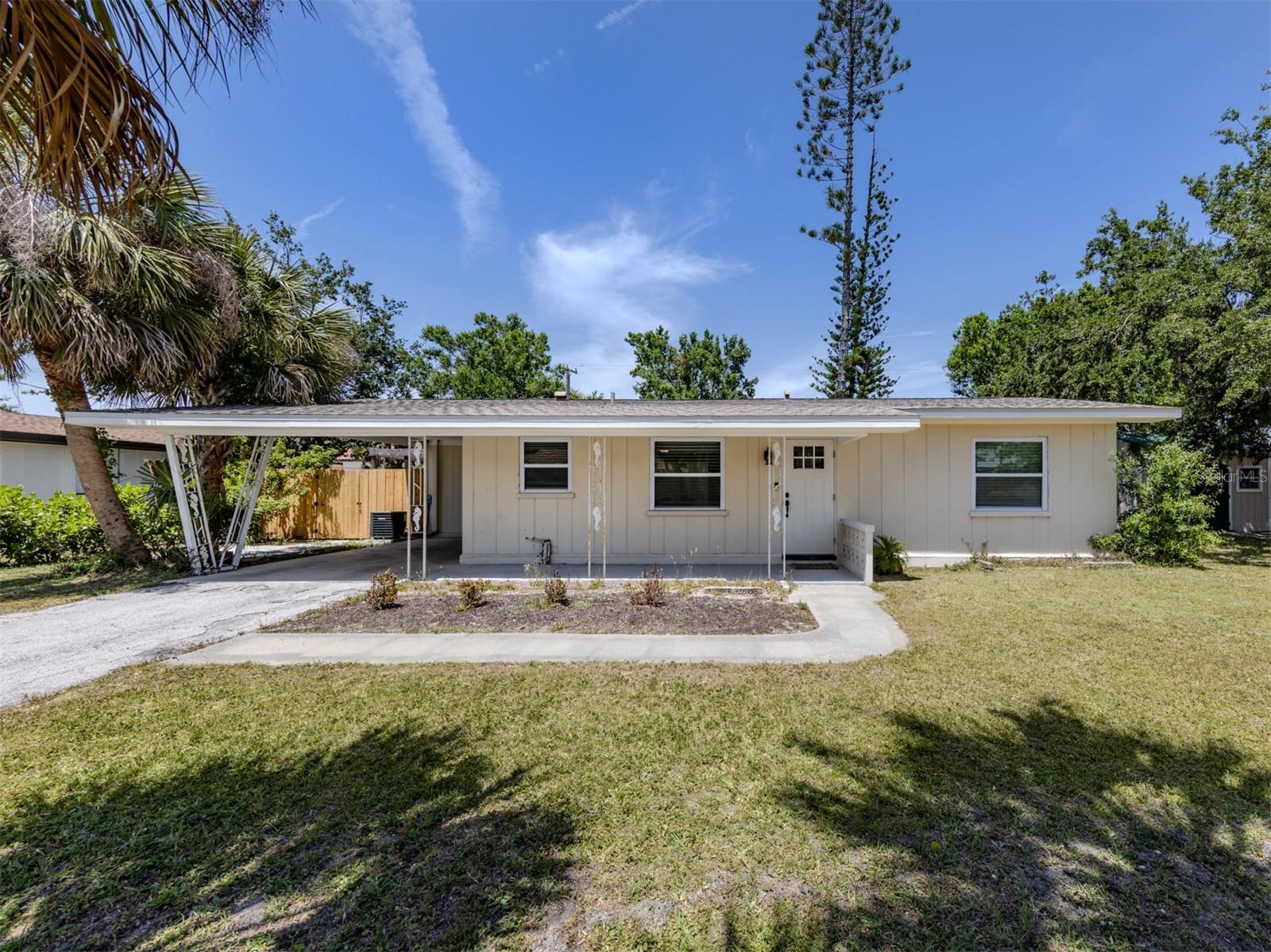 LOCATION! 2 miles from the beach and historic downtown Venice! Where all your favorite shops and restaurants awaits you! NEWER ROOF, AC, plumbing, and electrical! NO HOA FEE. With hurricane impact windows throughout, except for the Florida room, you can enjoy a peace of mind while embracing coastal living. The open floor plan features tile flooring, and a beautifully updated kitchen with inviting butcher block counters. The spacious backyard offers plenty of room for outdoor gatherings or relaxing in the sun. Pet owners dream! Completely fenced in backyard so your dog can play out in the yard stress free! After a day at the beach, explore the nightlife that downtown has to offer. This property could be your future vacation home, or an amazing investment opportunity! Ready to create lasting memories in the heart of Venice!