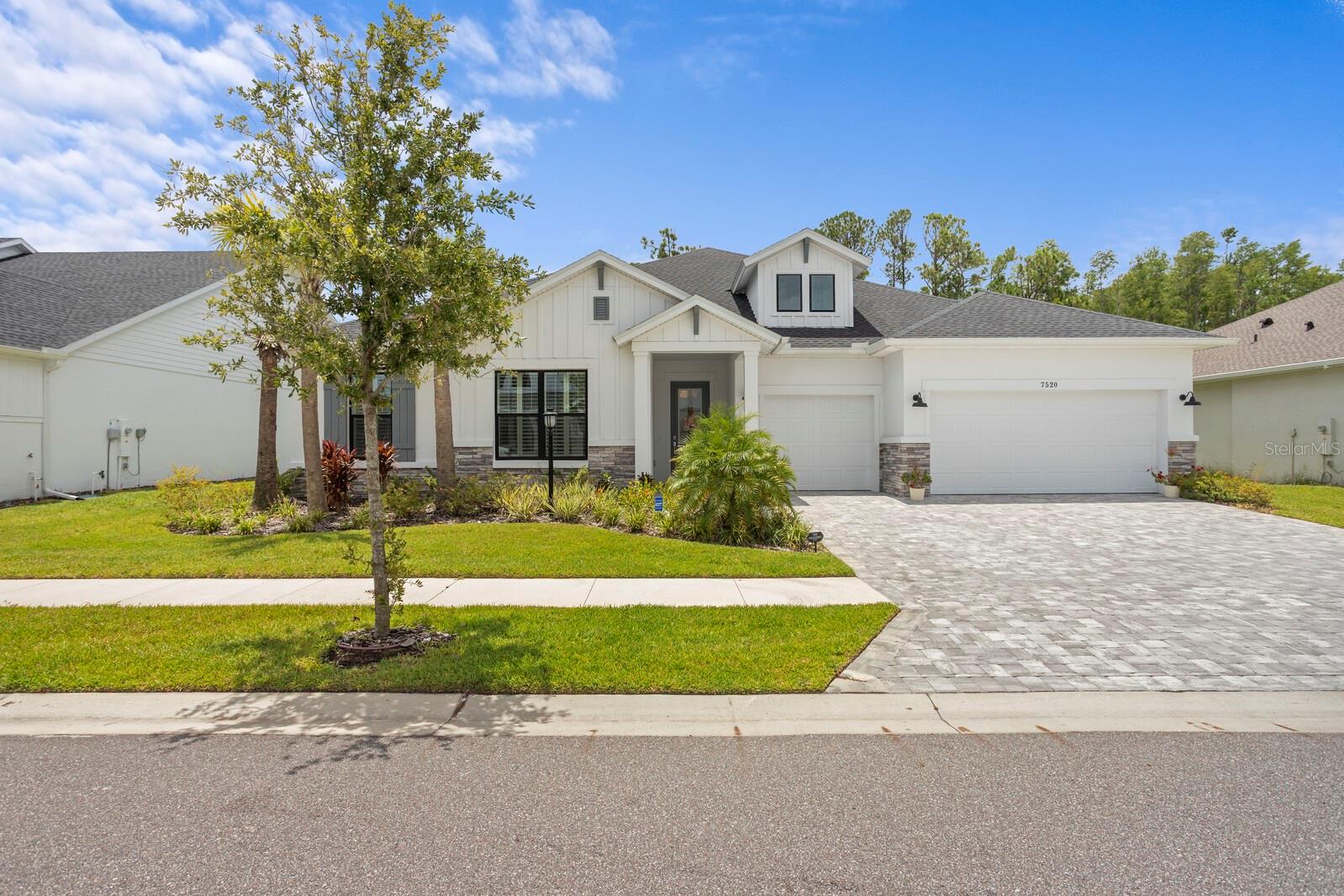 Welcome to Copeland Creek — a boutique, gated community nestled in the highly desirable Odessa area. This stunning David Weekley Hollowell floor plan offers over 3,200 square feet of thoughtfully designed living space, complete with premium finishes and tasteful upgrades throughout. Featuring 4 spacious bedrooms, 3.5 luxurious bathrooms, a private office with French doors, and a versatile flex room, this home effortlessly blends style and functionality. The unique split-bedroom layout ensures privacy while showcasing an expansive open-concept kitchen, living, and dining area — ideal for entertaining or relaxing with family. The chef’s kitchen is a showstopper, equipped with abundant cabinetry, sleek stainless steel appliances, upgraded fixtures, a wine fridge, and a charming farmhouse sink. Retreat to the serene owner’s suite located at the rear of the home with tranquil pond views, a spa-inspired bath, and a massive custom walk-in closet. Two bedrooms share a well-appointed full bath in one wing, while a separate hallway leads to a private bedroom with its own ensuite — perfect for guests or multigenerational living. The oversized laundry room includes a built-in sink and counter space, and a practical mudroom drop zone offers convenient storage and organization. Curb appeal abounds with a paved driveway and elegant stone accents. Enjoy the peace and security of a quiet gated neighborhood, close to scenic parks, nature trails, top-rated schools, and easy access to the Veterans Expressway and everything Tampa has to offer. Built in 2023, this exceptional home is your opportunity to own a slice of luxury in one of Odessa’s most sought-after communities.
