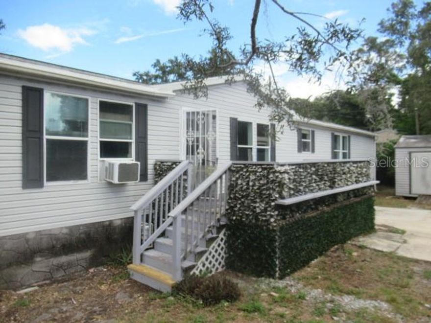 Discover the potential of this 3-bedroom, 2-bath manufactured home located in the heart of Dunedin. This property features a split-bedroom plan, a spacious living room with a fireplace, a large kitchen that includes a built-in desk area, and an inside utility room for added convenience. Outside, you’ll find a two-car driveway and a large storage shed, offering extra functionality and space.

The home is in need of renovations and repairs, making it an excellent opportunity for those with vision and creativity to bring it back to life. With updates and improvements, it could become a charming primary residence, a stylish seasonal retreat, or an investment property in a highly desirable area.

The location is one of the standout features, just minutes from downtown Dunedin, where you can enjoy shopping, dining, breweries, galleries, and waterfront parks. Honeymoon Island State Park is approximately 6.7 miles away, about a 15-minute drive, offering pristine beaches and natural beauty. The Dunedin Causeway also provides direct access to coastal recreation, while Tampa is about 23 miles away, roughly a 30- to 35-minute drive depending on traffic.

This home presents an exciting renovation project with plenty of possibilities. All information is believed to be accurate but is not guaranteed. Buyers and agents are encouraged to verify all facts pertinent to their purchase decision.