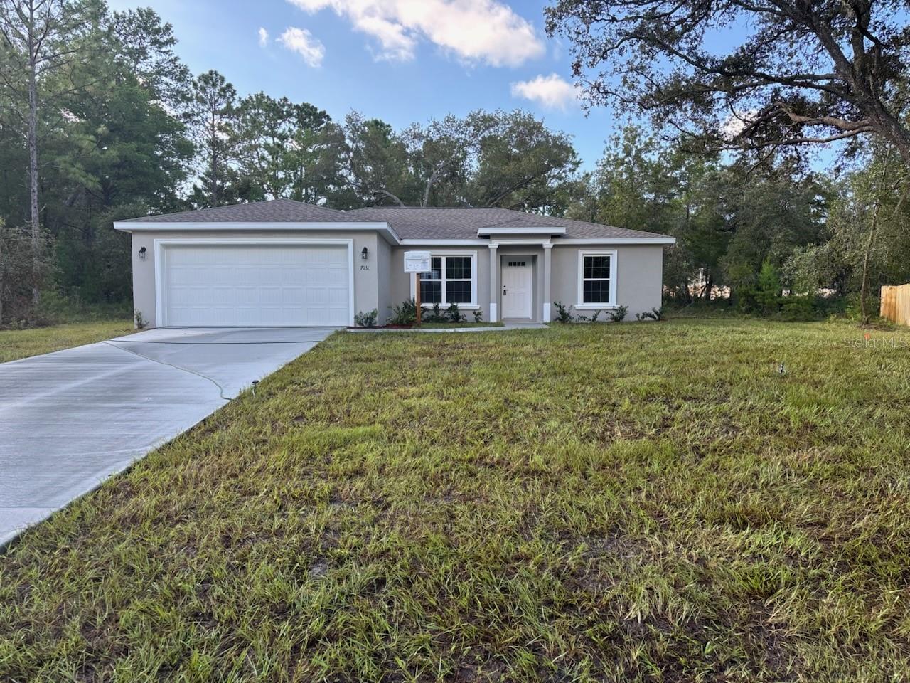 NEW CONSTRUCTION. MOVE-IN READY! This beautiful Key West Model offers 3 bedrooms, 2 bathrooms, and 1,405 square feet of well-designed living space. The master suite is the largest this builder offers, giving you plenty of room to relax. Built with sturdy concrete block construction and a 30-year architectural shingle roof, this home also features energy-efficient double-pane windows and comes with a 10-year structural warranty for peace of mind. The open living area boasts a vaulted ceiling, luxury vinyl plank flooring, and a modern kitchen with stainless steel appliances, custom white shaker cabinets with soft-close drawers, granite countertops, a pantry, and a subway tile backsplash. Both bathrooms include upgraded marble-look tile, with a glass-enclosed shower in the master and a tub/shower combo in the main bath. Enjoy a full cabinet package in the laundry room, plus a covered patio and an attached 2-car garage with opener and remotes. This home sits on a larger 1/3-acre lot with a privacy fence along the right side, providing added comfort and space. Located in flood zone X, it is high and dry and does not require flood insurance, and there are no HOA fees for added freedom.