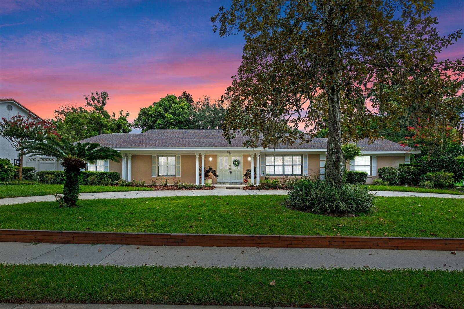 Welcome home to this lovely 4-bedroom, 3.5-bath pool home in the prestigious Sevilla neighborhood of Winter Park! Tucked off a charming brick-lined street just ¼ mile from Park Avenue, this .40-acre property offers both privacy and convenience to your Winter Park lifestyle.
Inside, you’ll find timeless details such as marble and parquet flooring, crown molding, plantation shutters throughout, and custom built-ins. The heart of the home is the kitchen and family room—both overlooking the pool and anchored by a cozy wood-burning brick fireplace with built-in shelving. Two bedrooms share a Jack & Jill bath, while another offers custom shelving—perfect for a home office or study. The primary suite features a spacious walk-in closet and an en-suite bath framed by elegant architectural columns, with private access directly to the pool area. Step outside to your own tropical retreat—an expansive screened, heated pool that lights up in the evenings, surrounded by lush landscaping, multiple seating areas, a covered brick patio, and a charming brick outdoor kitchen waiting for your personal touch. This well-built concrete block home also features a double-door entry and an extended covered front patio—ideal for welcoming guests, relaxing in rocking chairs, or adding seasonal décor throughout the year. Additional highlights include a circular driveway, oversized side-entry garage, fenced yard, spacious laundry room, low HOA, Blink security system, and a roof replaced in 2007. Close proximity to Rollins College, top-rated Winter Park schools, and private schools, this home has been lovingly cared for by the same owner for 33 years. With your personal updates, it has the potential to become a true showpiece in one of Winter Park’s most desirable neighborhoods. Enjoy all that Winter Park living has to offer—fine dining, boutiques, art festivals, lakes, and cultural events—just minutes from your front door.