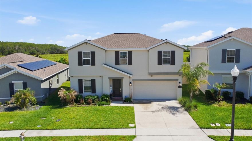Perfectly located in St. Cloud, FL, 4980 Four Strand Ct puts you just minutes from shopping, restaurants, theme parks, major roads, and the airport. This stunning 5-bedroom, 2.5-bathroom home offers 2,896 square feet of move-in ready living space that your family will love.

Step inside and you'll notice the high ceilings and open floor plan right away. The main living areas downstairs feature beautiful hard flooring that flows throughout, giving the home a clean and modern feel. The kitchen is a real standout with quartz counters, stainless steel appliances, and a large pantry that gives you all the storage you need. Whether you're cooking for the family or entertaining friends, this space makes it easy.

Head upstairs and you'll find a bonus loft area that's perfect for a game room, home office, or extra hangout spot. The bedrooms and loft are carpeted for comfort, and there's plenty of room for everyone to spread out. A convenient laundry room keeps daily chores simple and organized.

One of the best features of this home is the backyard with no rear neighbors, giving you extra privacy and a peaceful setting to relax. Plus, solar panels help keep those energy bills low, which is always a win in Florida.

This home checks all the boxes for comfort, space, and convenience. Don't wait too long on this one. Schedule your showing today and see everything 4980 Four Strand Ct has to offer!