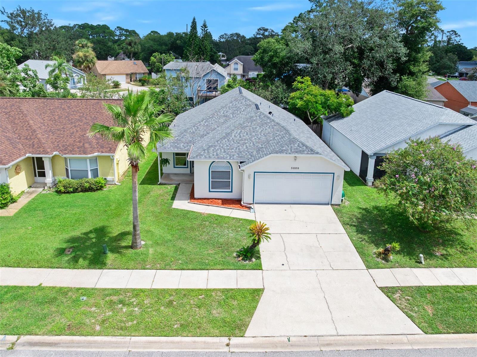Welcome to this completely redone 3-bedroom, 2-bathroom home in beautiful Port Orange. Spanning 1,233 sq. ft, this property has been meticulously renovated from top to bottom, offering a fresh, modern, and move-in-ready living space. Step inside to a bright and inviting interior, completely refreshed with new paint throughout and new window treatments. Enjoy the peace of mind that comes with a brand-new roof, installed in 03/2025. The heart of this home is a dazzling new kitchen, featuring all-new appliances and cabinets for a sleek, modern cooking experience. New ceiling fans have been installed to enhance comfort and provide a fresh, updated look. Relax and unwind in your fenced backyard's privacy. The screened-in back porch is the perfect spot for enjoying a cup of coffee or outdoor dining. Stroll or walk your dog along the serene, scenic pond nearby. This home perfectly blends modern comfort and a desirable Florida lifestyle. Don't miss this like-new home in Port Orange